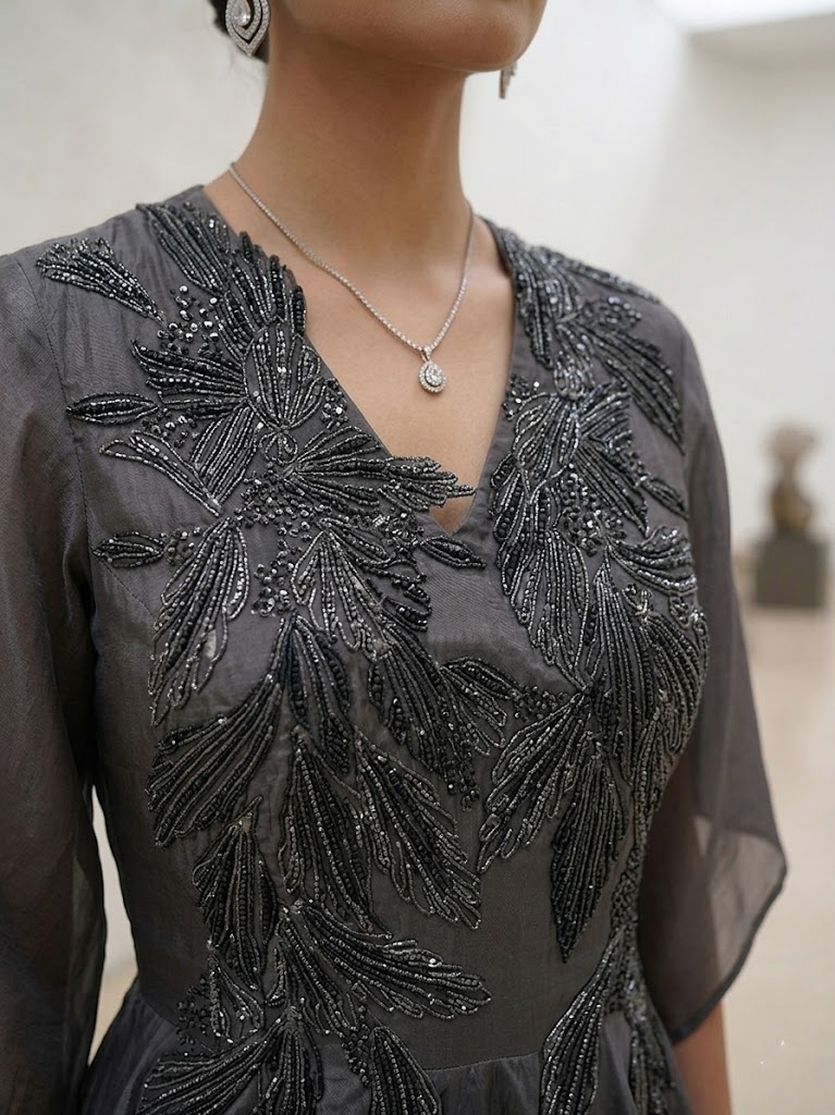 STYLISH GREY DRESS WITH ELEGANT  EMBROIDERY ON THE FRONT.