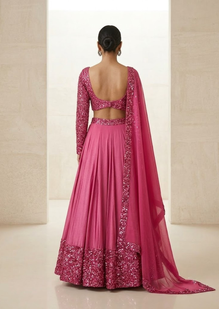 PINK SEQUIN EMBELLISHED LEHENGA SET WITH MATCHING BLOUSE AND DUPATTA.