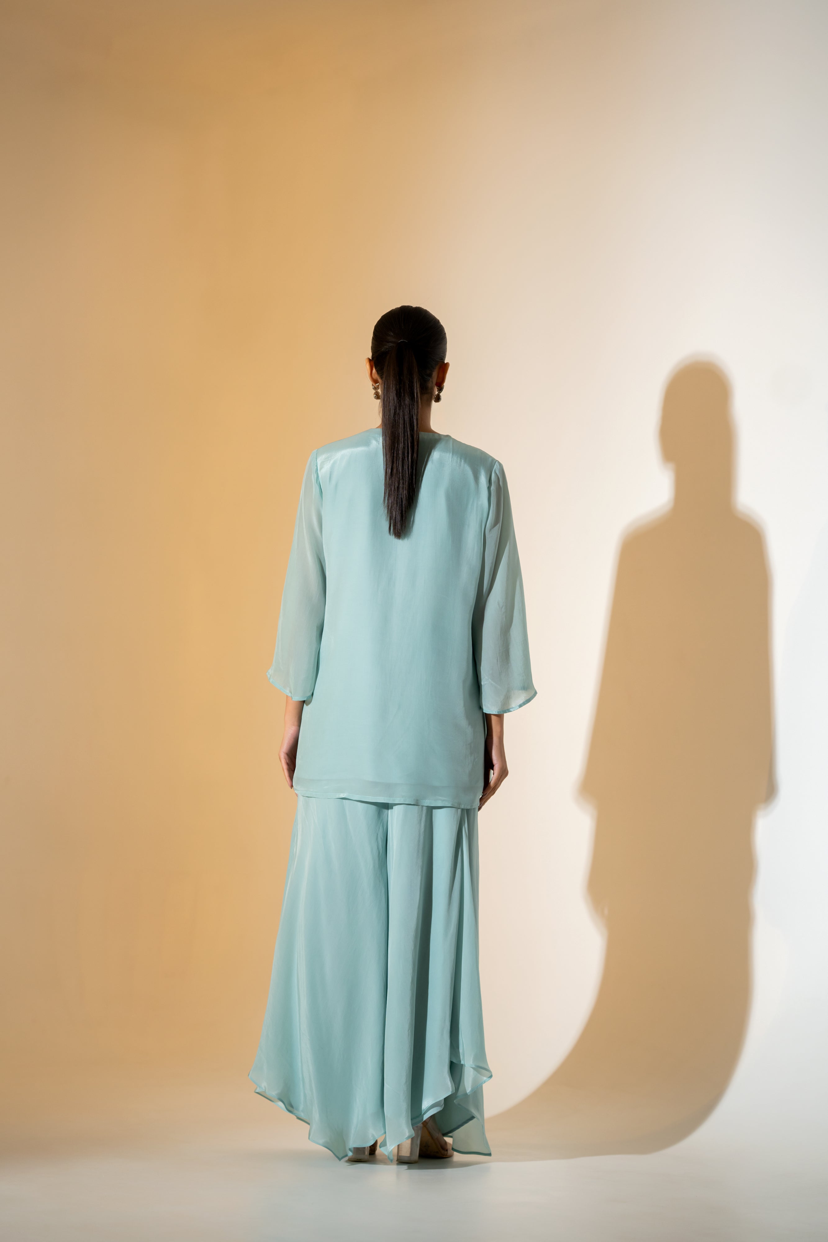 PASTEL AQUA EMBROIDERED KURTA SET WITH FLARED PANTS AND A SCALLOPED DUPATTA.