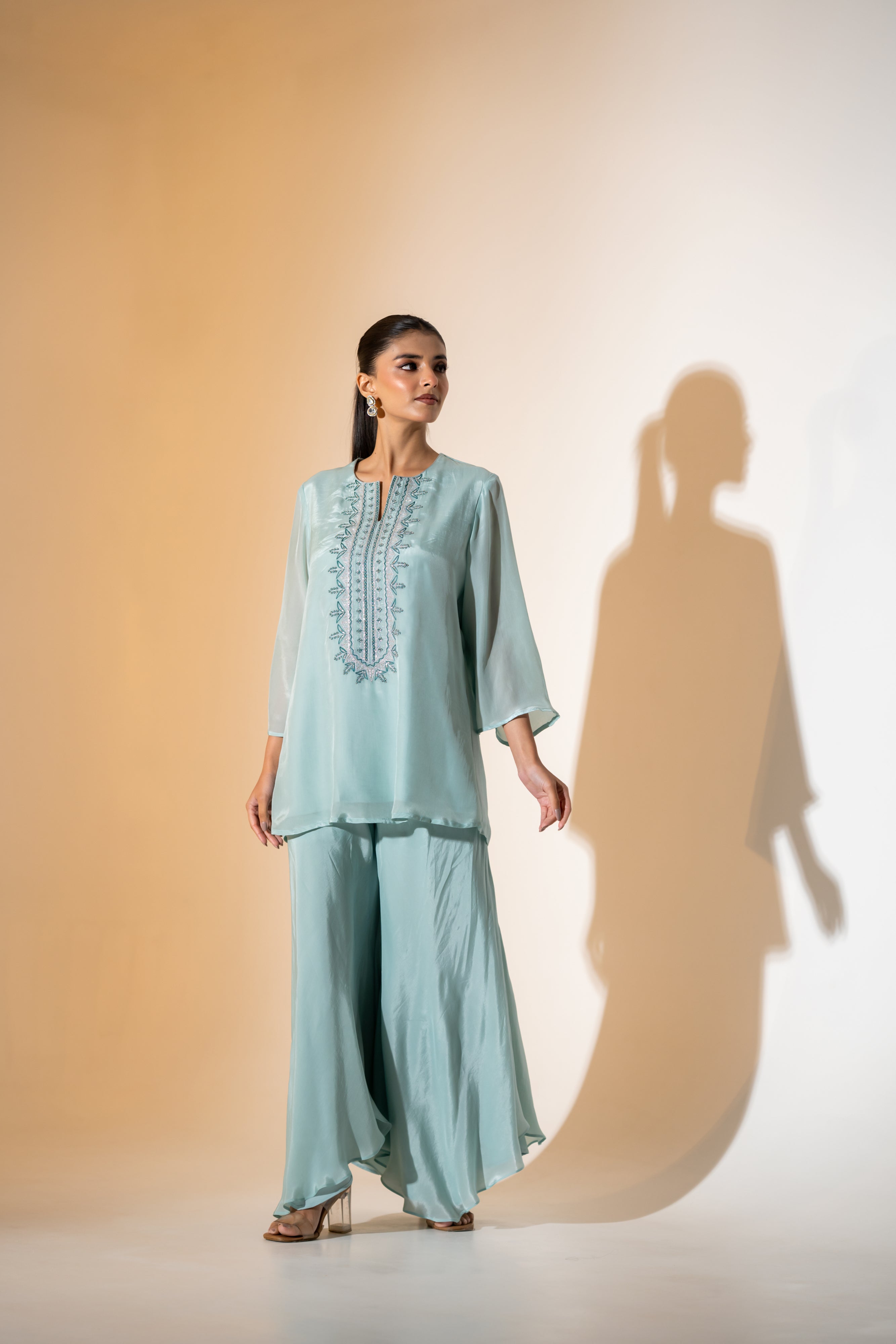 PASTEL AQUA EMBROIDERED KURTA SET WITH FLARED PANTS AND A SCALLOPED DUPATTA.