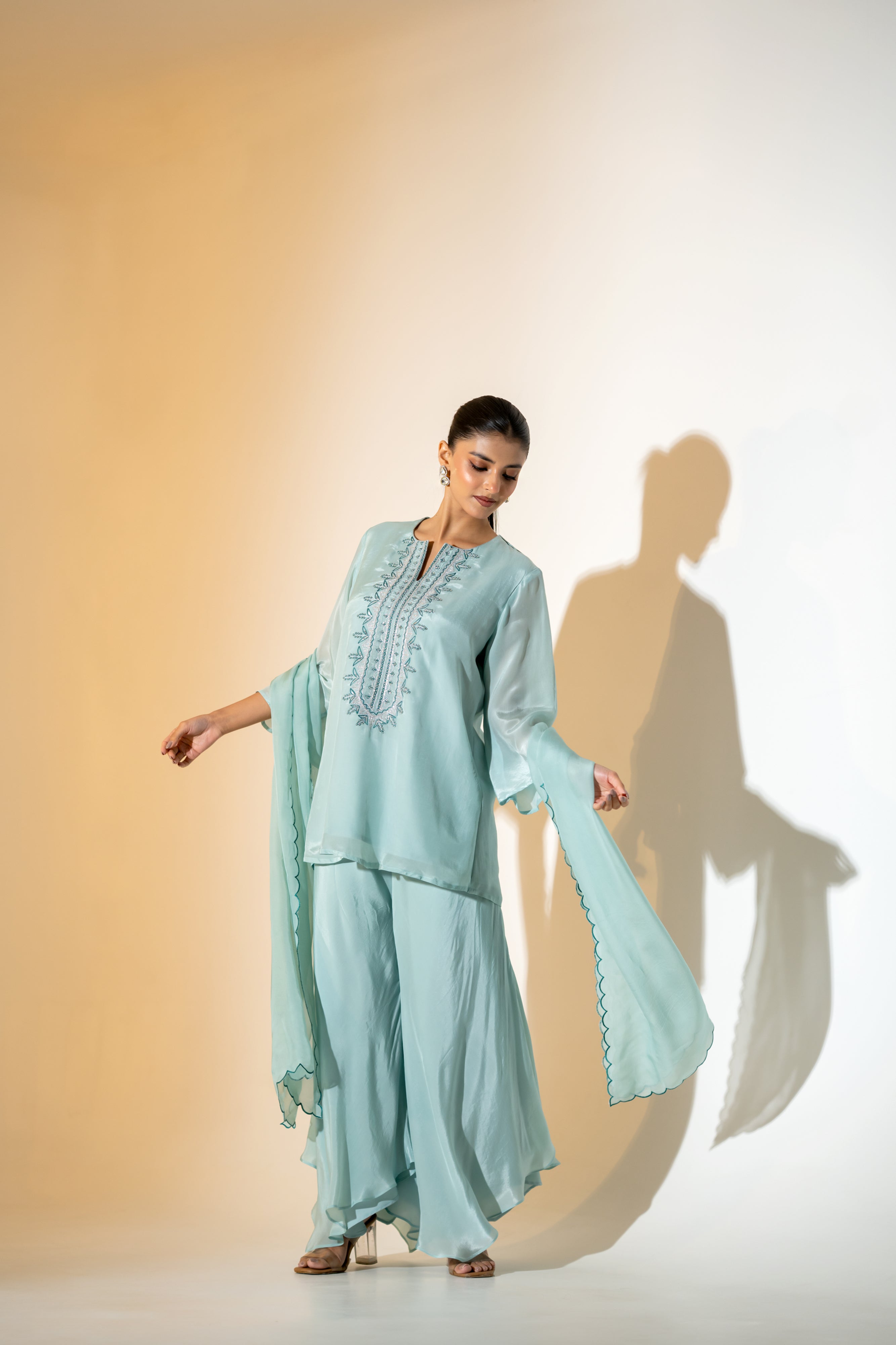 PASTEL AQUA EMBROIDERED KURTA SET WITH FLARED PANTS AND A SCALLOPED DUPATTA.