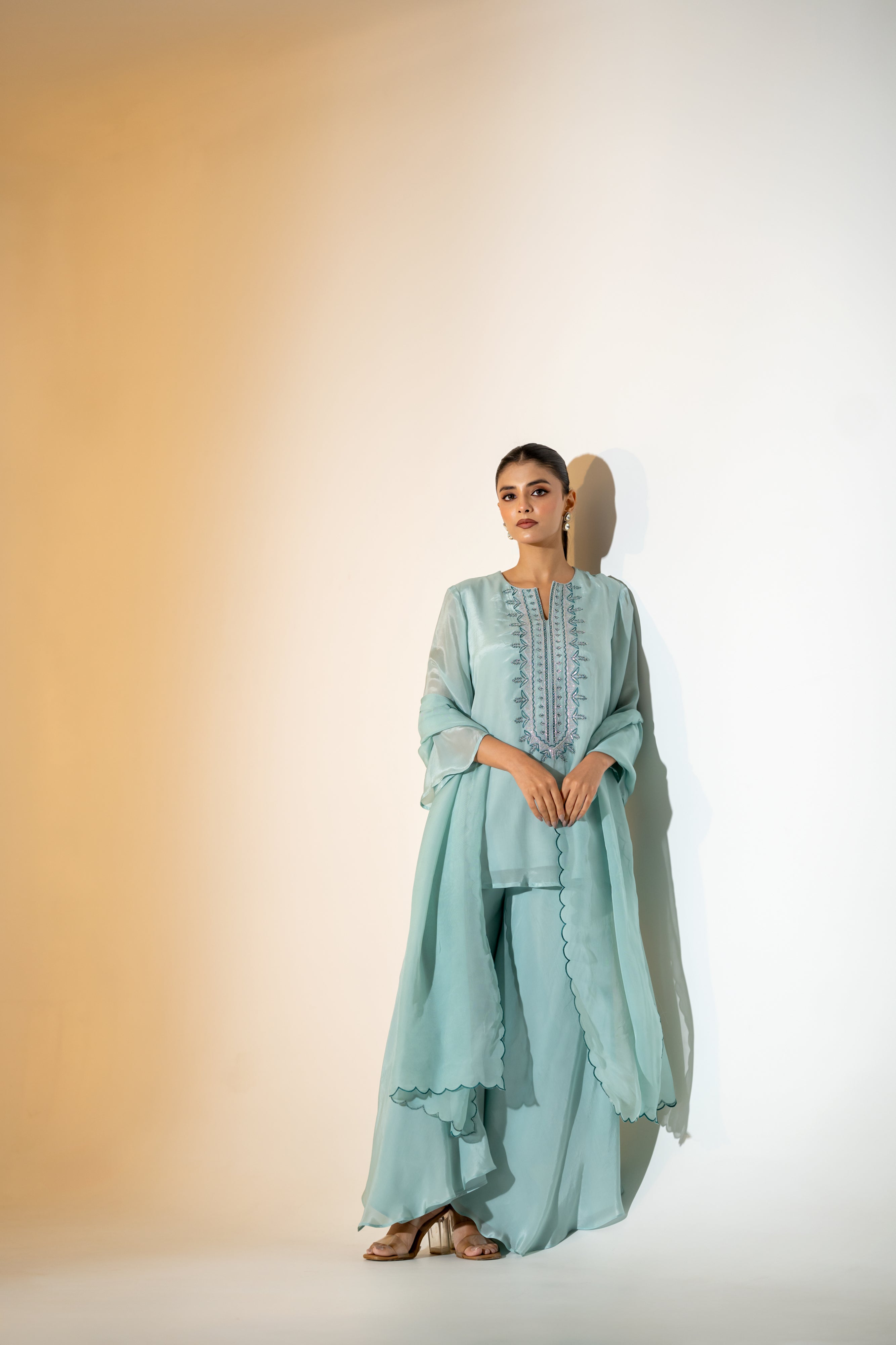 PASTEL AQUA EMBROIDERED KURTA SET WITH FLARED PANTS AND A SCALLOPED DUPATTA.