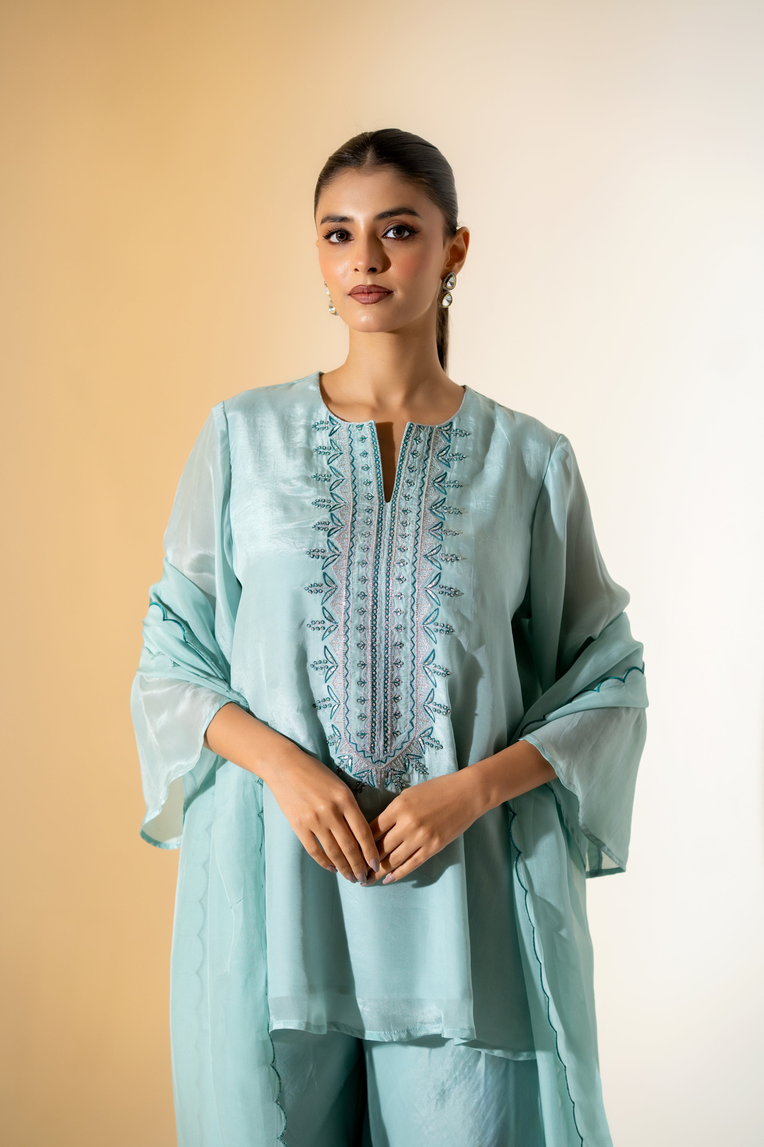 PASTEL AQUA EMBROIDERED KURTA SET WITH FLARED PANTS AND A SCALLOPED DUPATTA.