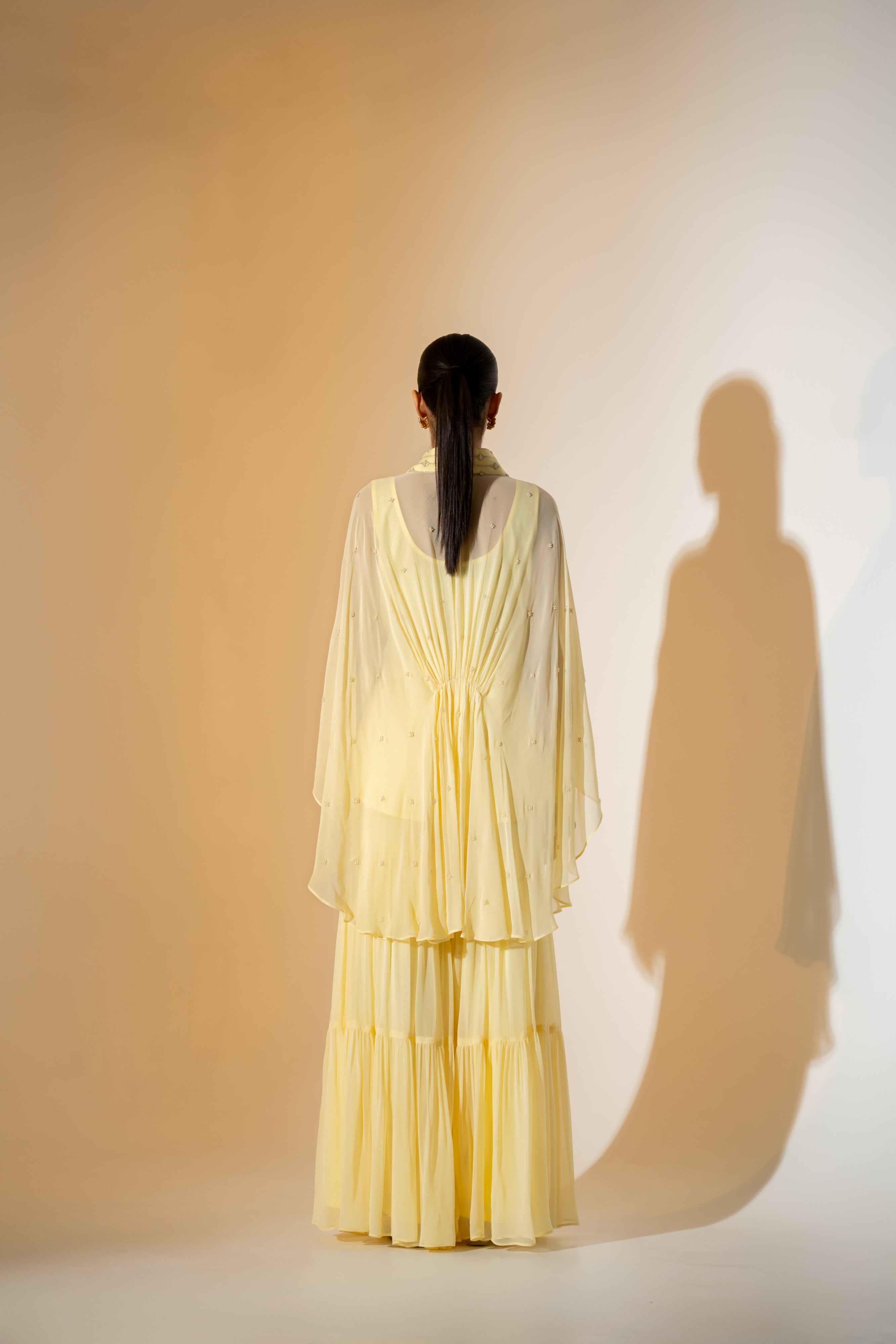 BUTTER YELLOW SHARARA SET WITH PEARL DETAILING & EMBROIDERED NECKLINE.