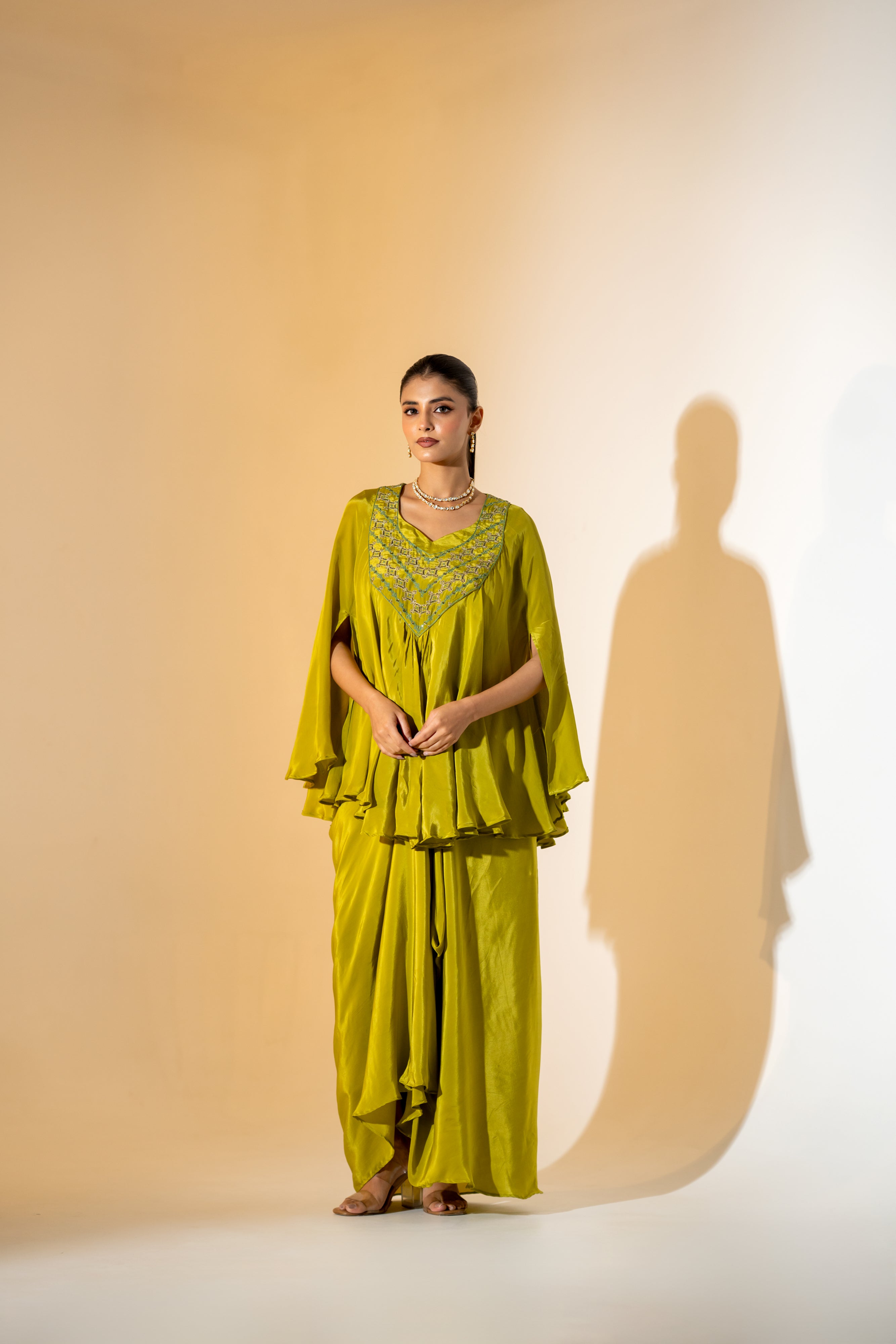 CHARTREUSE DRAPED SKIRT SET WITH CAPE- STYLE TOP AND EMBROIDERED YOKE.
