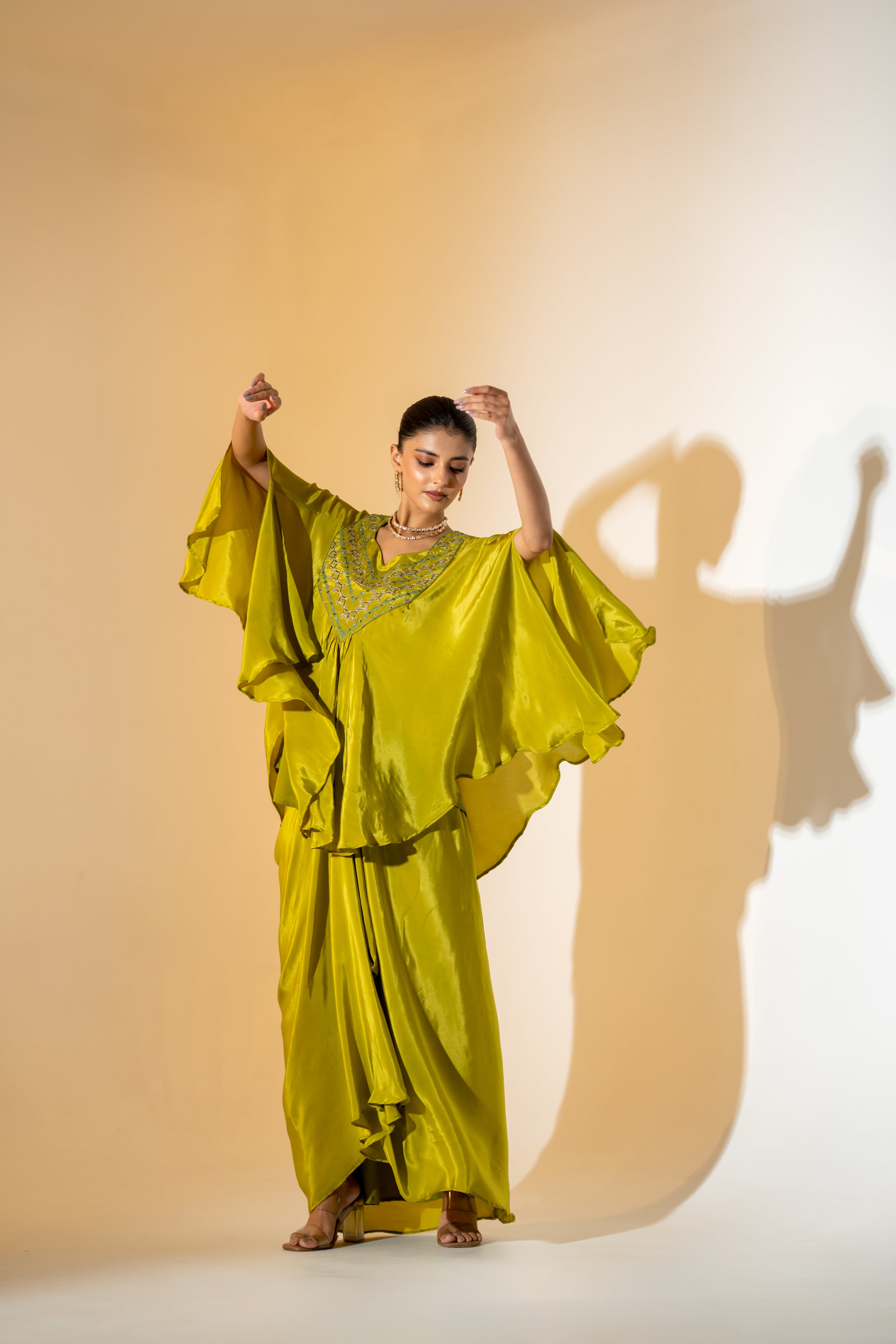 CHARTREUSE DRAPED SKIRT SET WITH CAPE- STYLE TOP AND EMBROIDERED YOKE.