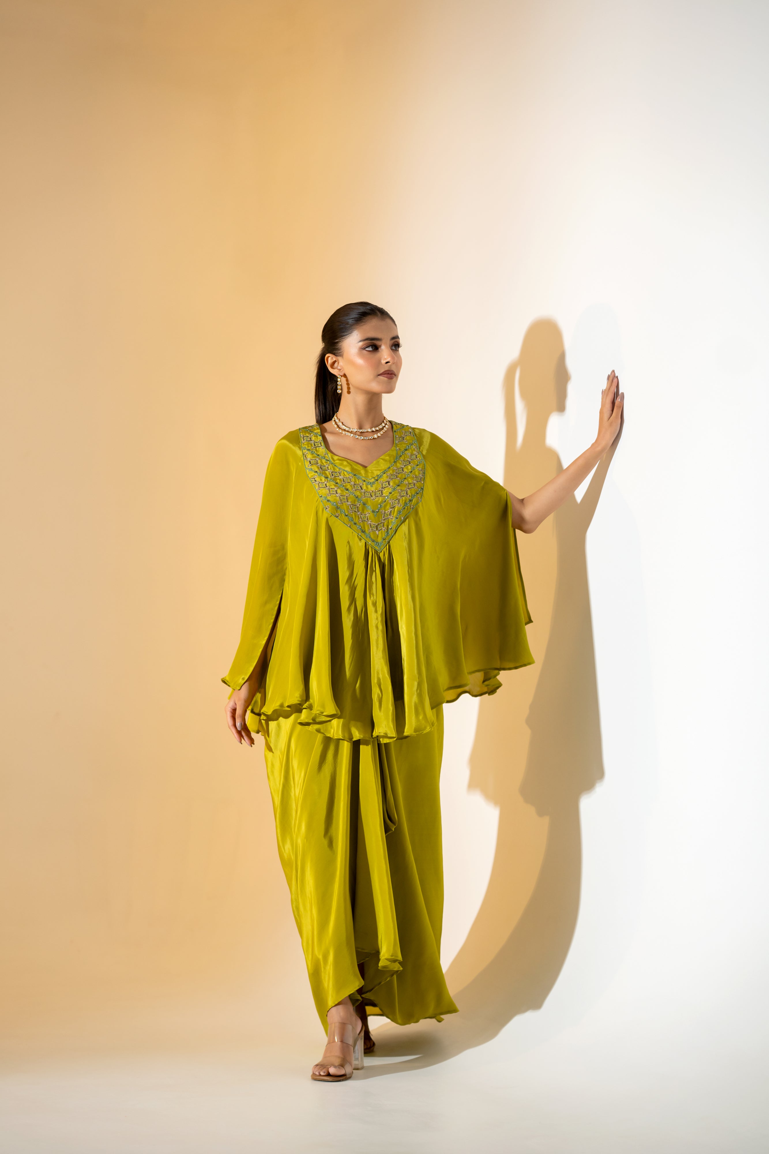 CHARTREUSE DRAPED SKIRT SET WITH CAPE- STYLE TOP AND EMBROIDERED YOKE.