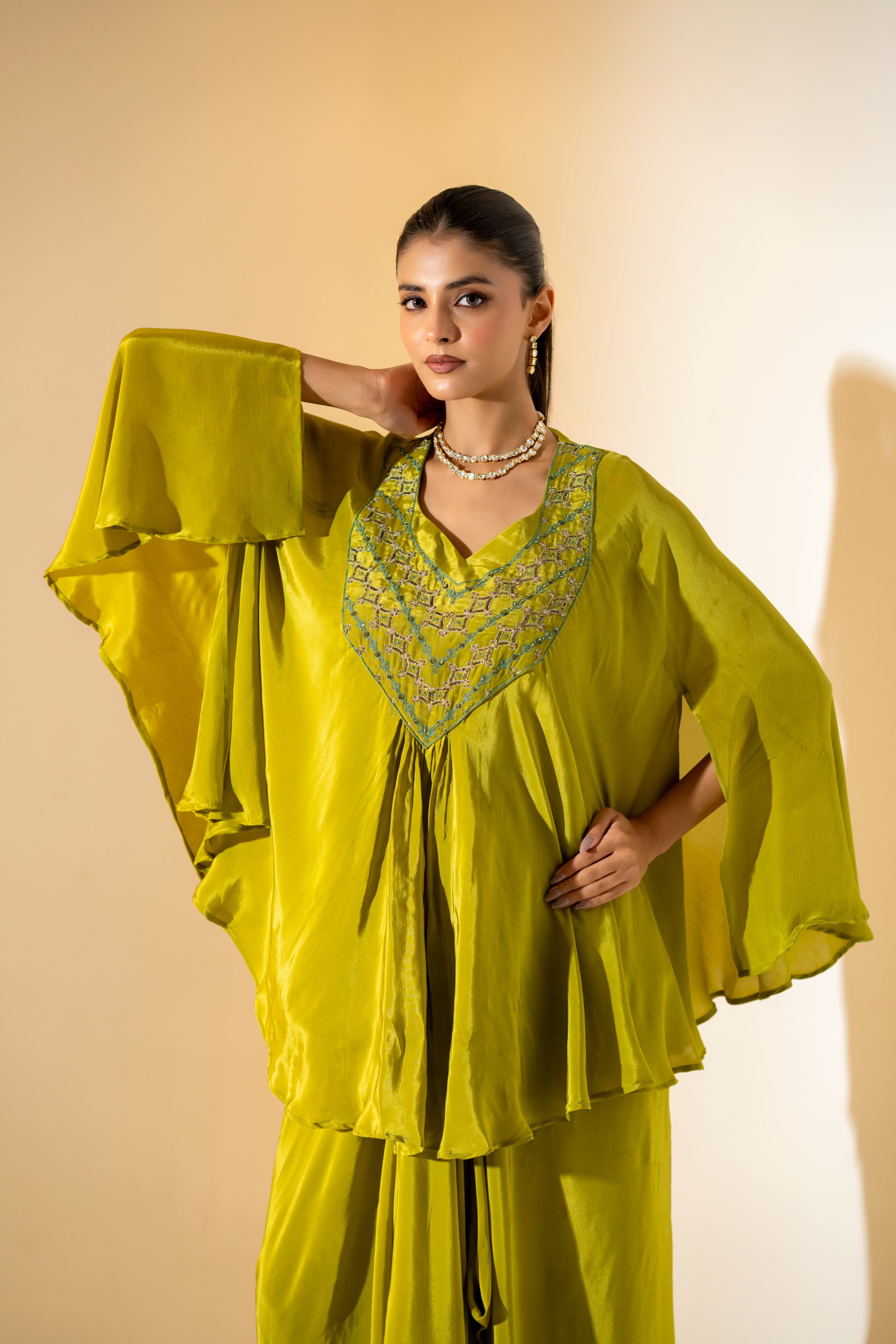 CHARTREUSE DRAPED SKIRT SET WITH CAPE- STYLE TOP AND EMBROIDERED YOKE.