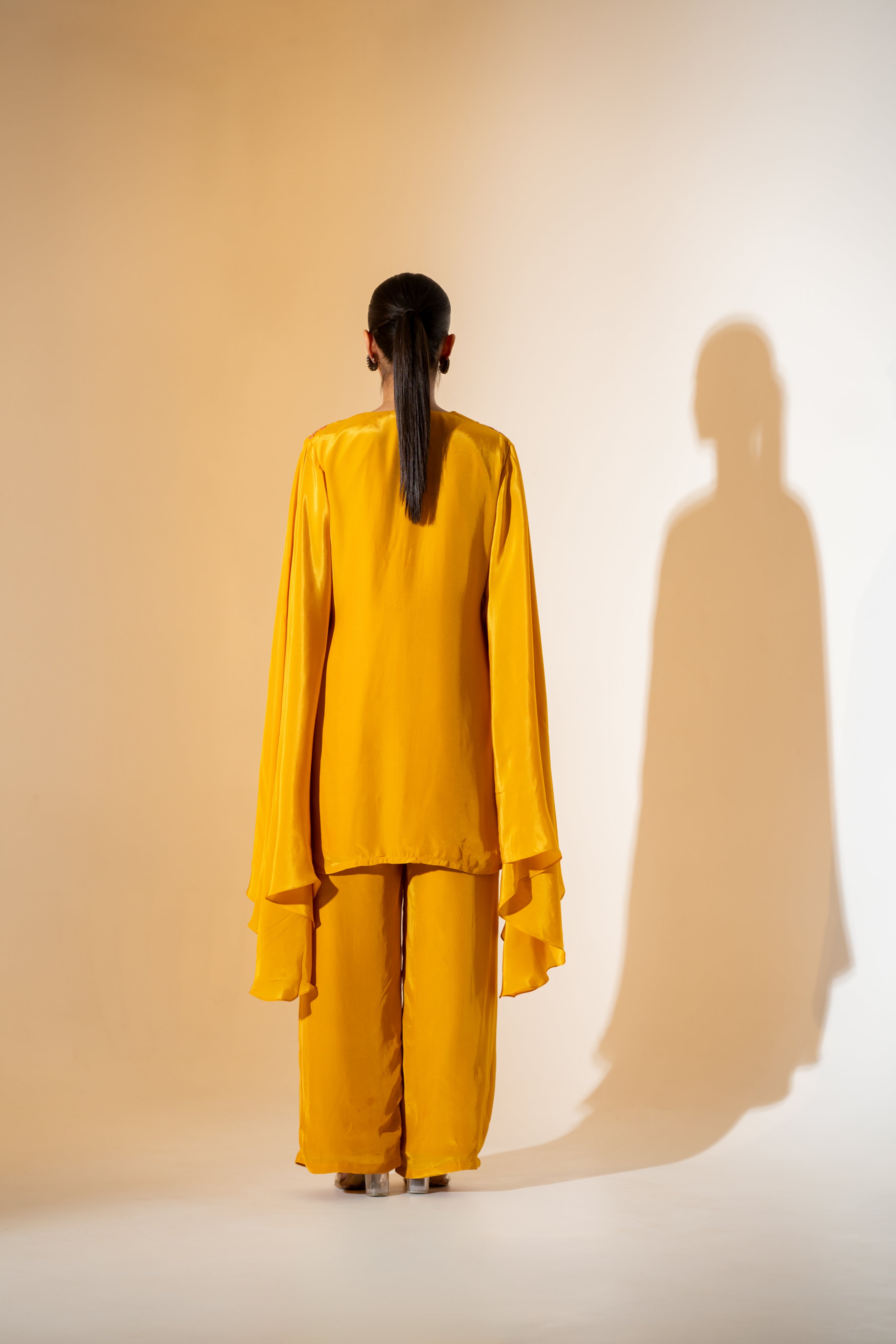 MUSTARD YELLOW CO-ORD SET WITH FLOWY ASYMMETRIC SLEEVES & CONTRAST EMBROIDERY.