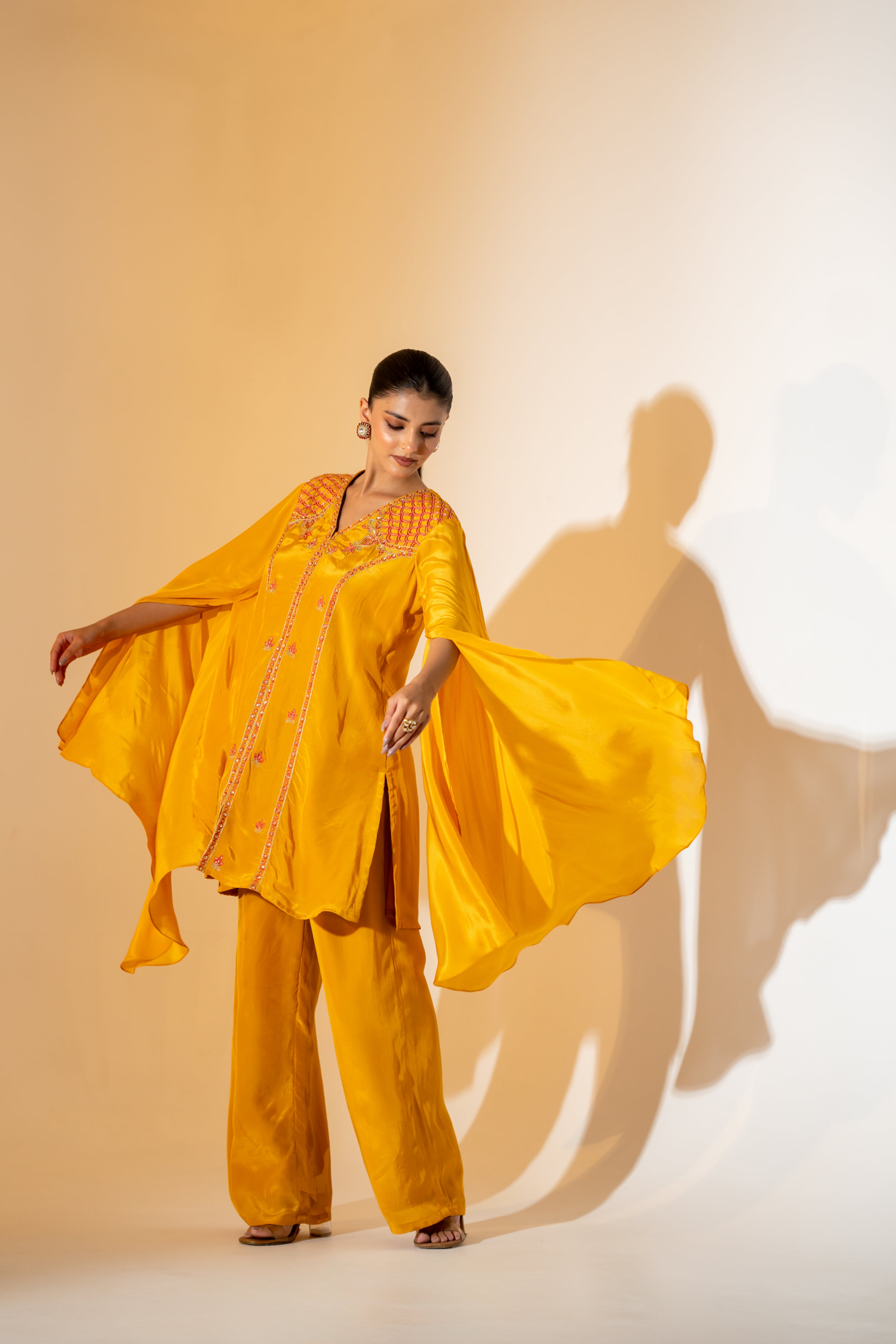MUSTARD YELLOW CO-ORD SET WITH FLOWY ASYMMETRIC SLEEVES & CONTRAST EMBROIDERY.