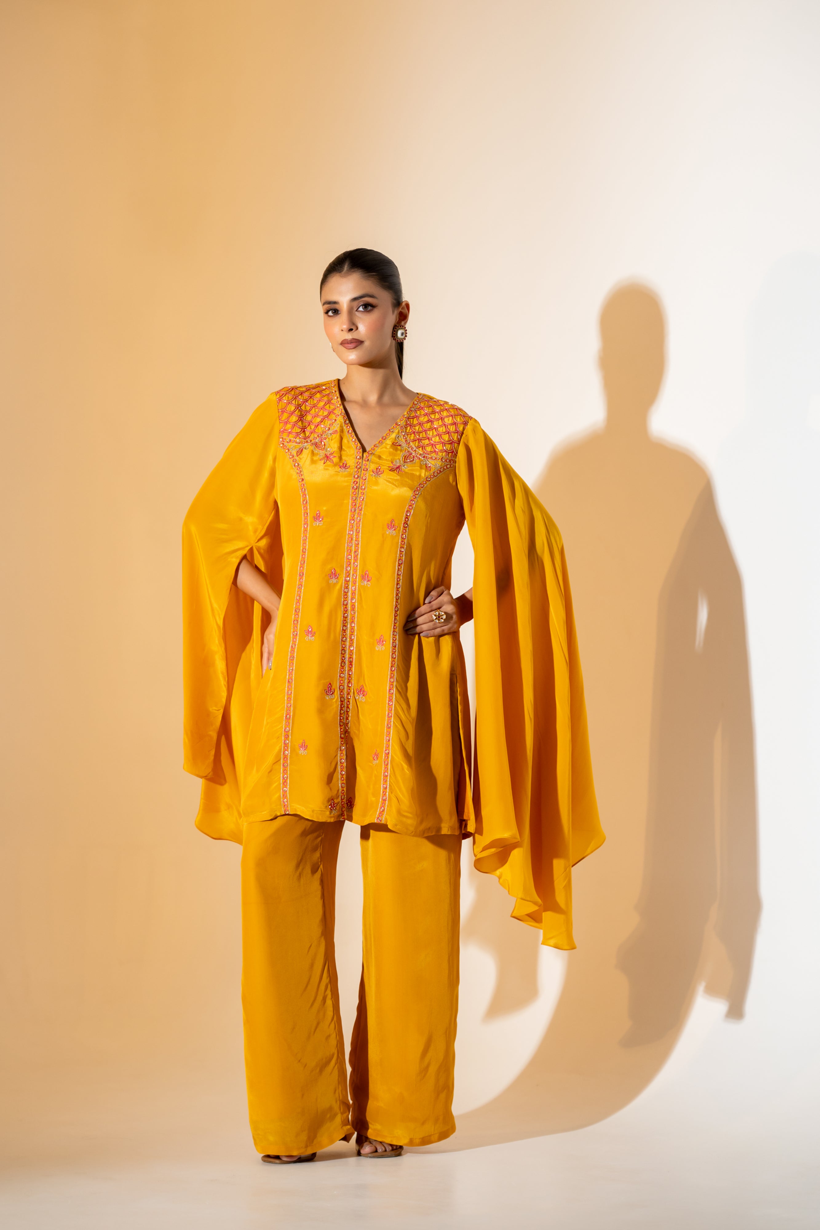 MUSTARD YELLOW CO-ORD SET WITH FLOWY ASYMMETRIC SLEEVES & CONTRAST EMBROIDERY.