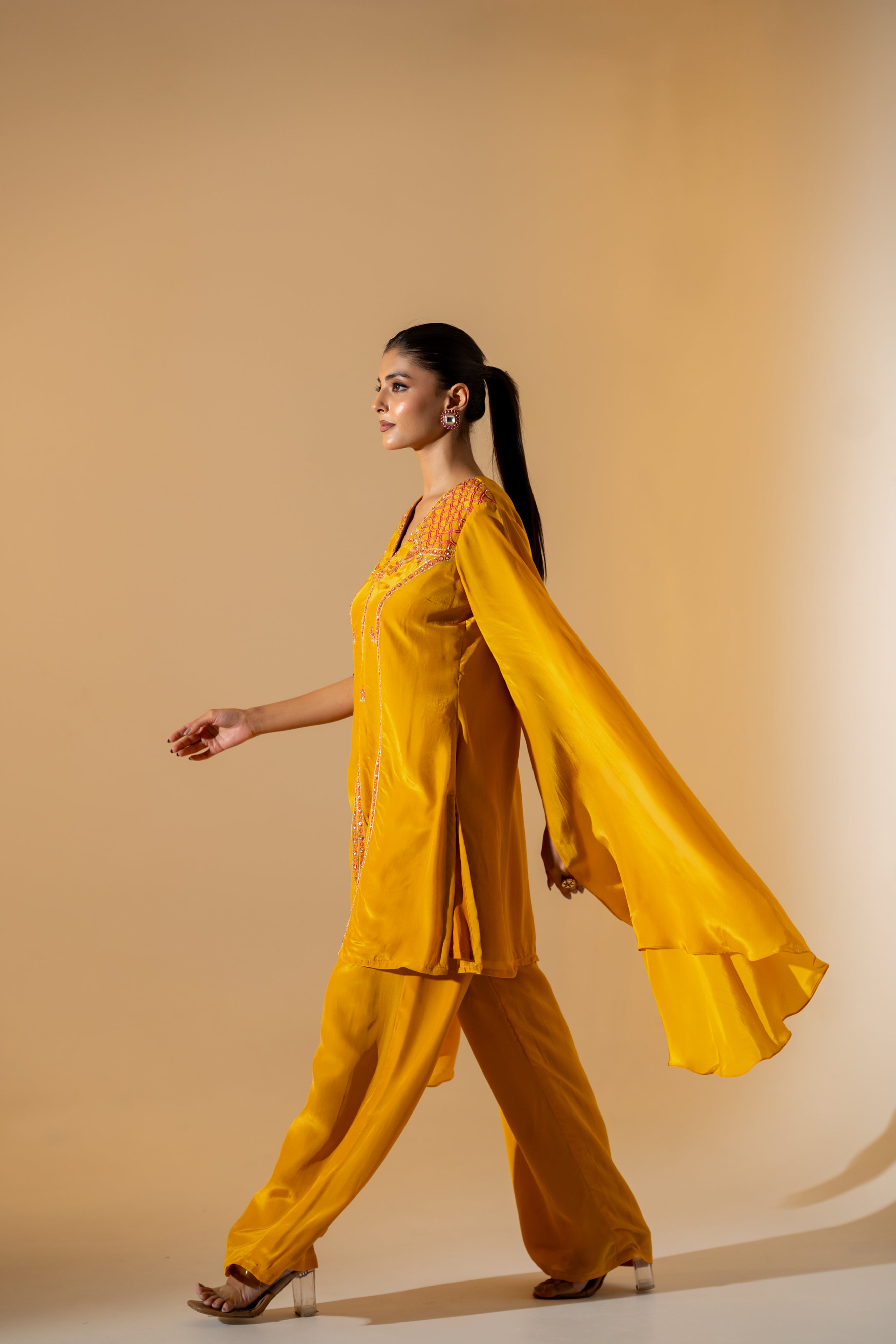 MUSTARD YELLOW CO-ORD SET WITH FLOWY ASYMMETRIC SLEEVES & CONTRAST EMBROIDERY.