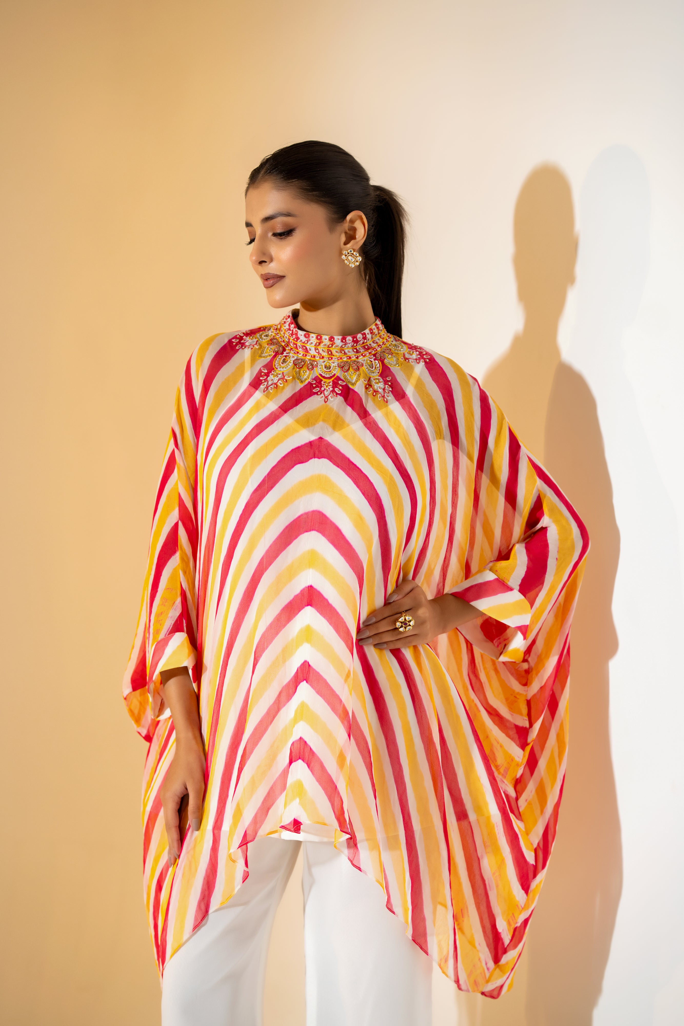CORALl AND YELLOW LEHERIYA KAFTAN TOP WITH  EMBROIDERED NECKLINE & WHITE PANT.