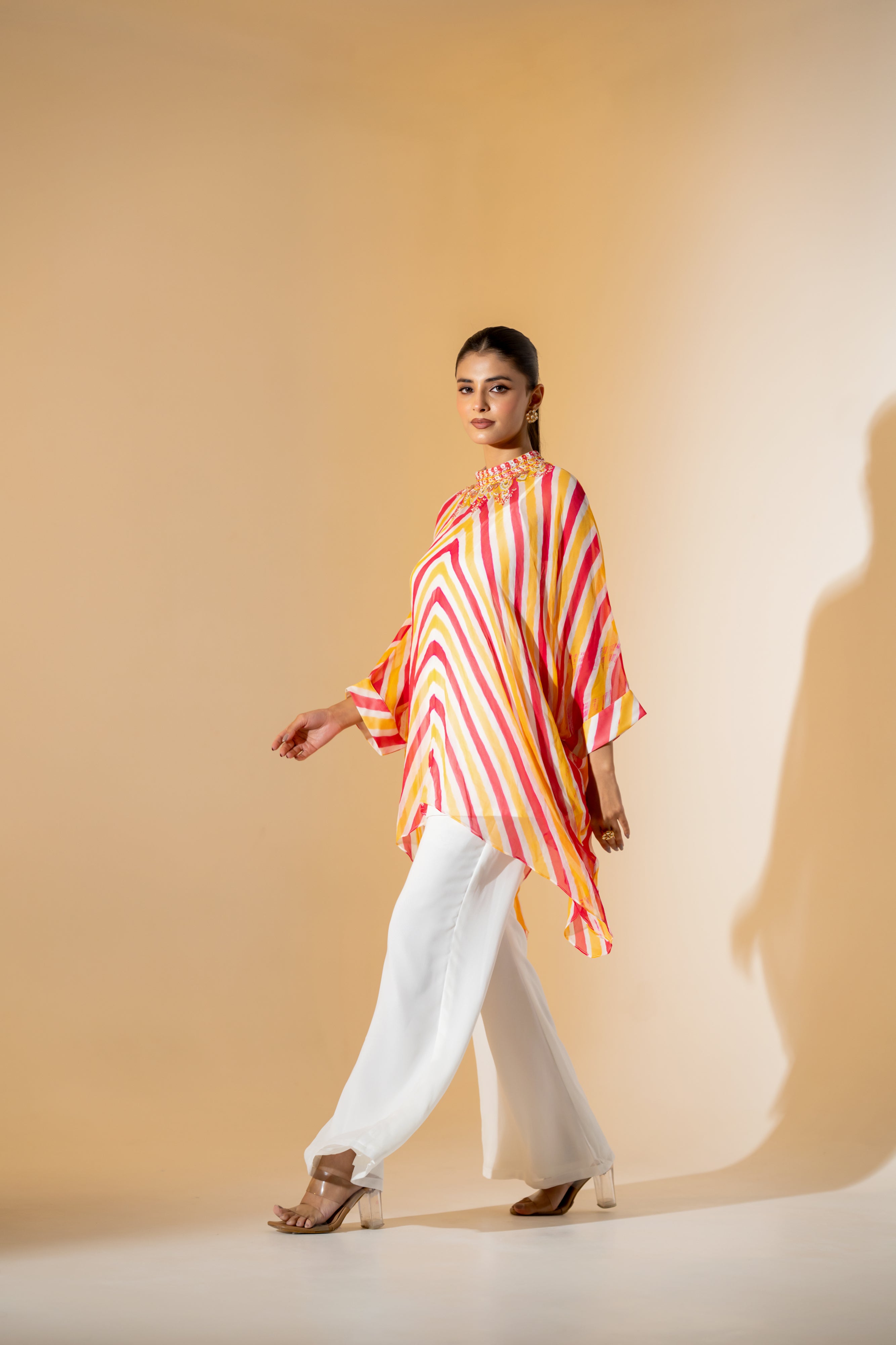 CORALl AND YELLOW LEHERIYA KAFTAN TOP WITH  EMBROIDERED NECKLINE & WHITE PANT.