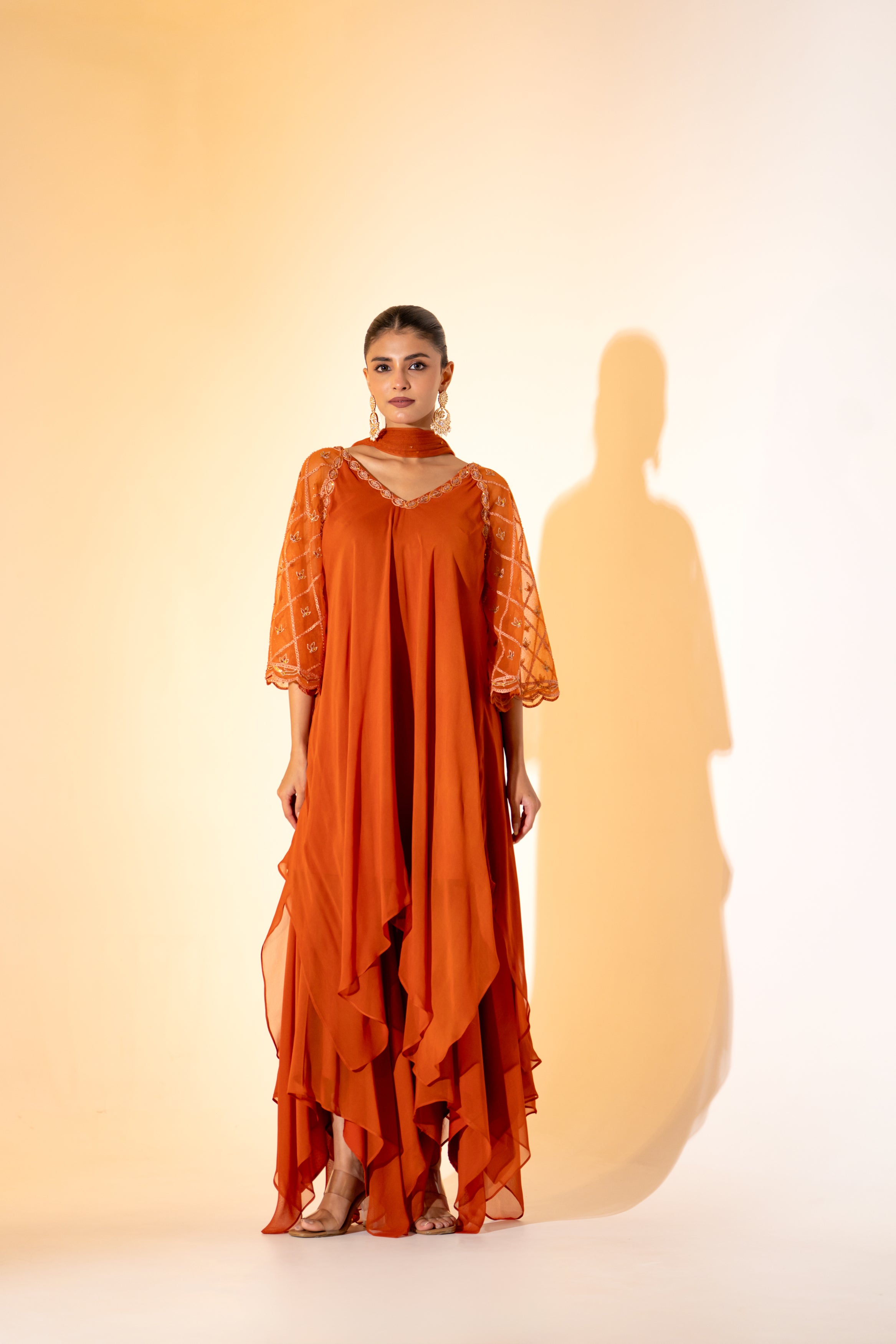RUST ORANGE SAHARA- STYLE LAYERED DRESS WITH EMBROIDERED SLEEVES AND SCARF.