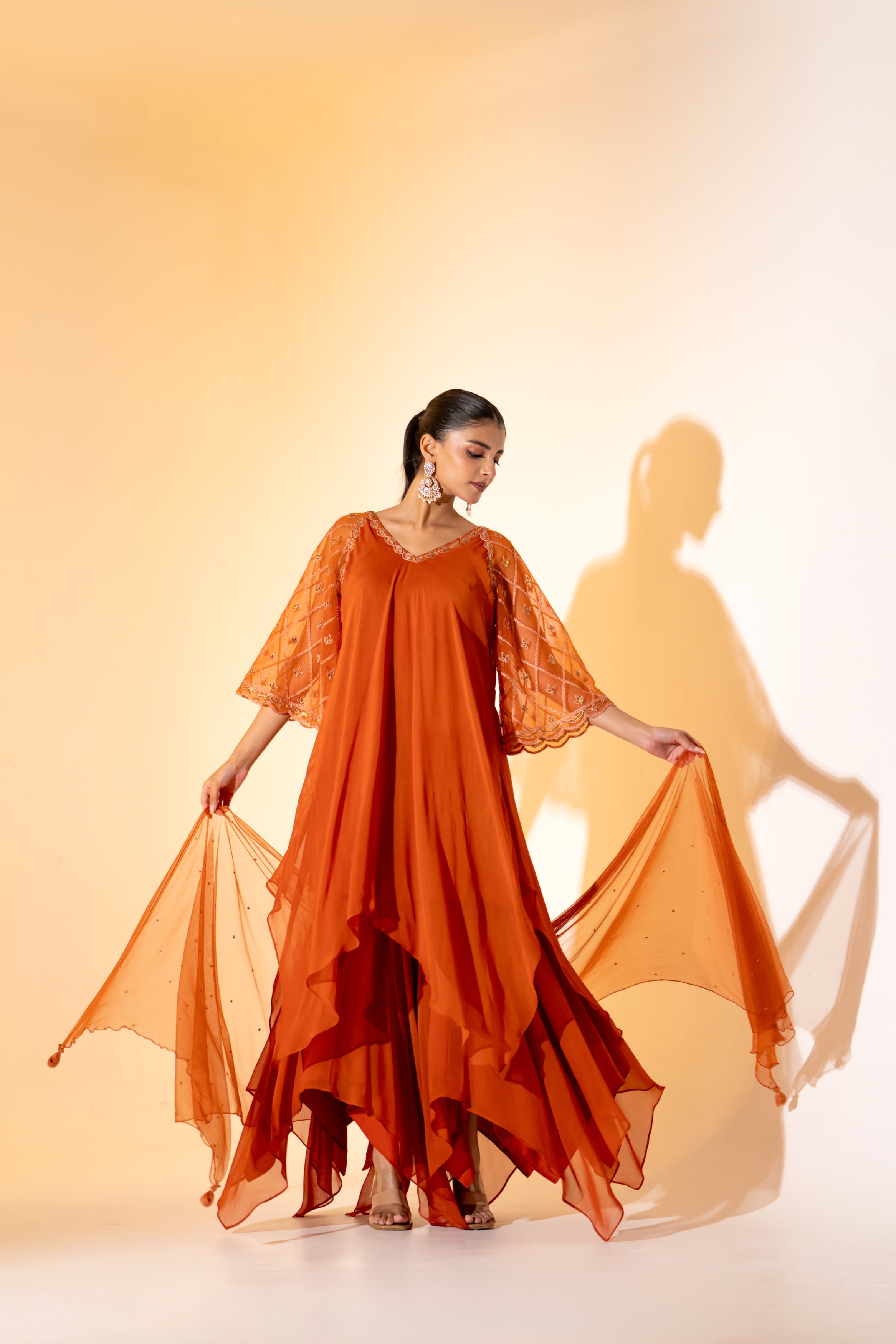 RUST ORANGE SAHARA- STYLE LAYERED DRESS WITH EMBROIDERED SLEEVES AND SCARF.