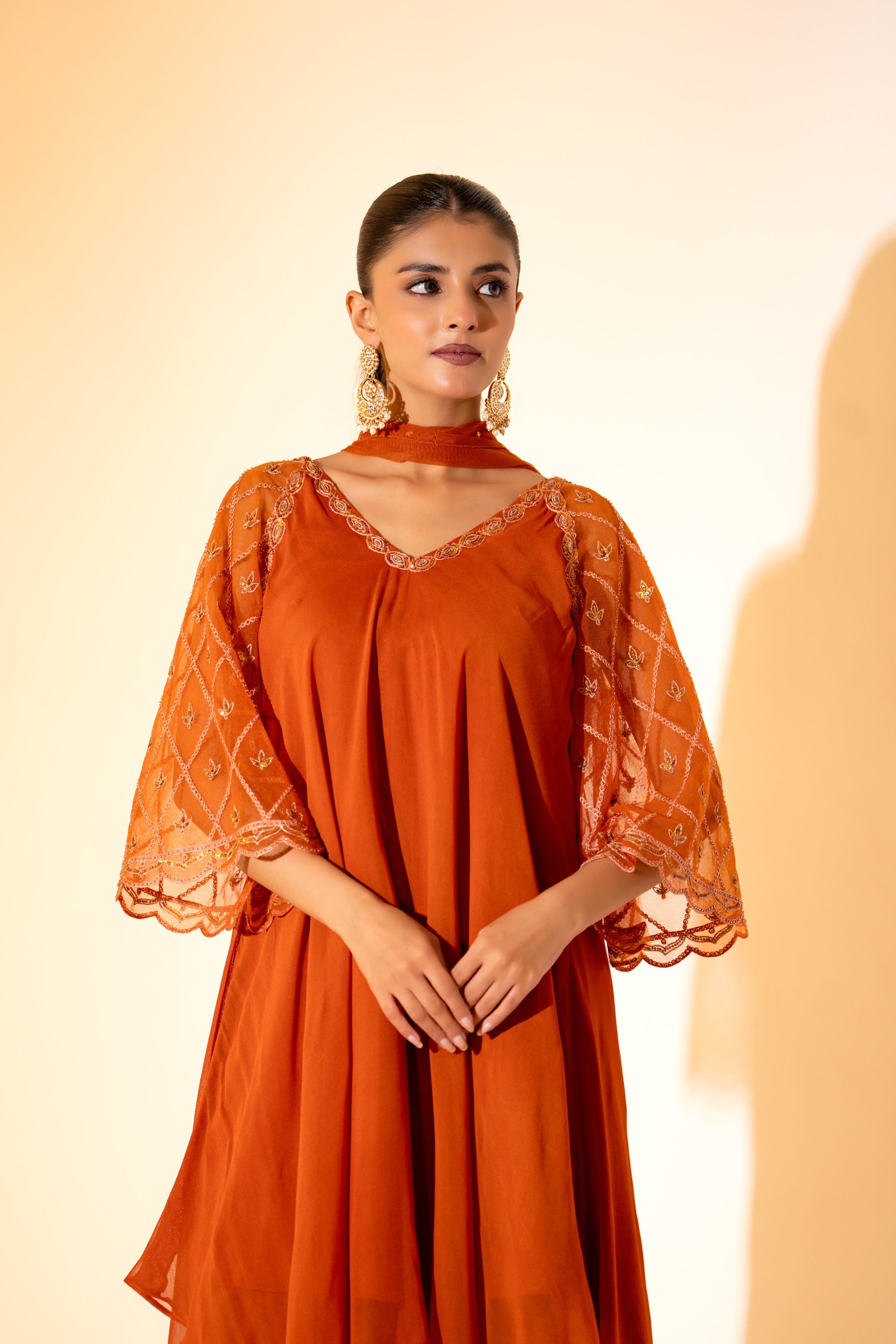 RUST ORANGE SAHARA- STYLE LAYERED DRESS WITH EMBROIDERED SLEEVES AND SCARF.