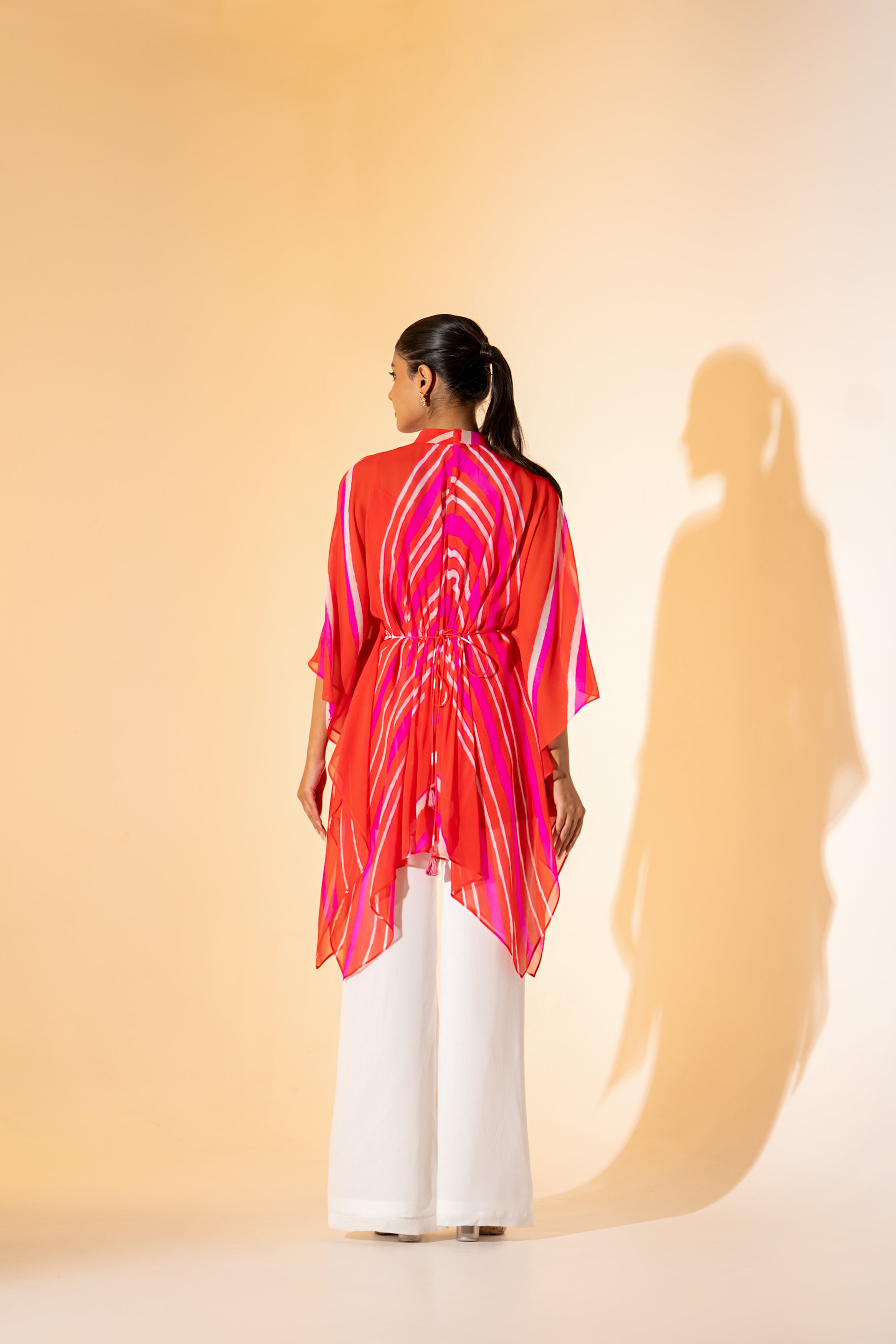 ORANGE LEHERIYA  KAFTAN TOP WITH WHITE PANT  & EMBROIDERED BELT.