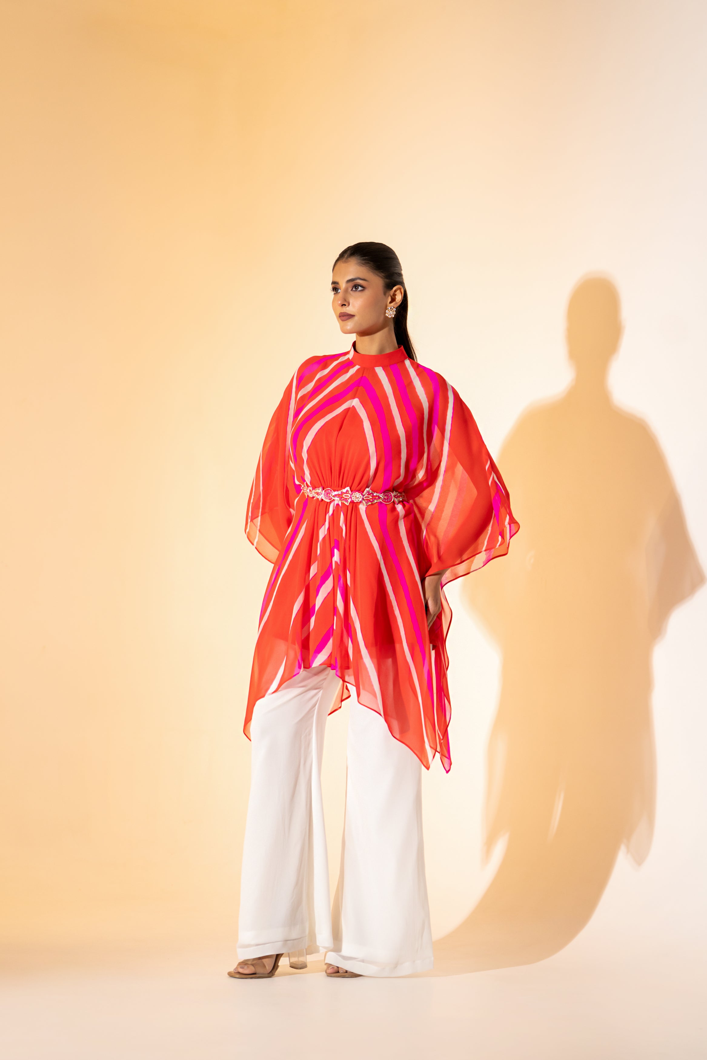 ORANGE LEHERIYA  KAFTAN TOP WITH WHITE PANT  & EMBROIDERED BELT.