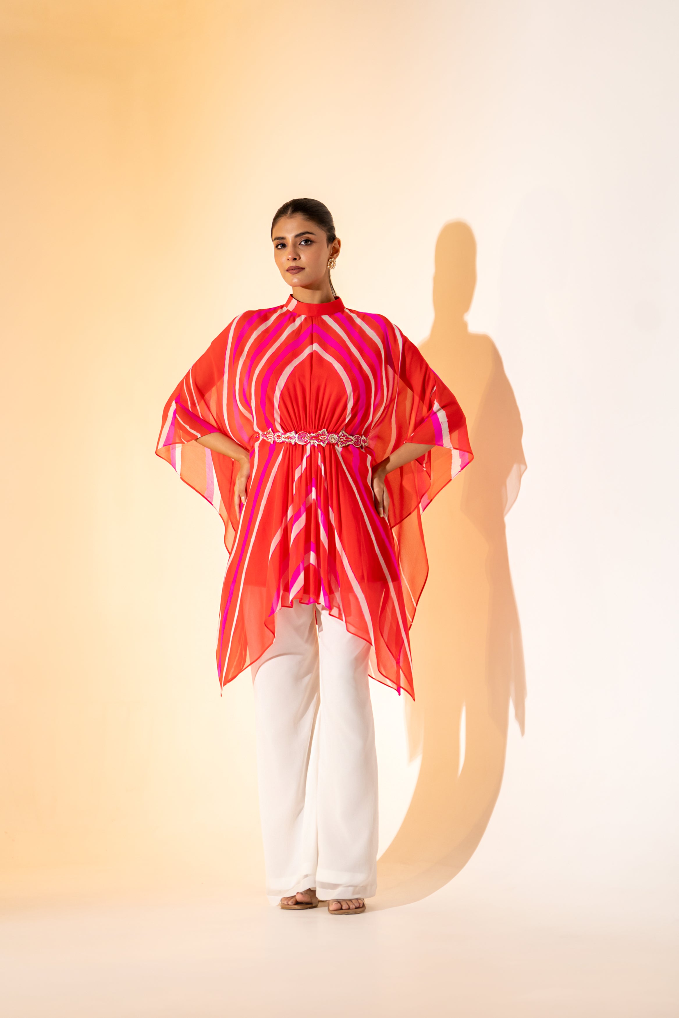 ORANGE LEHERIYA  KAFTAN TOP WITH WHITE PANT  & EMBROIDERED BELT.