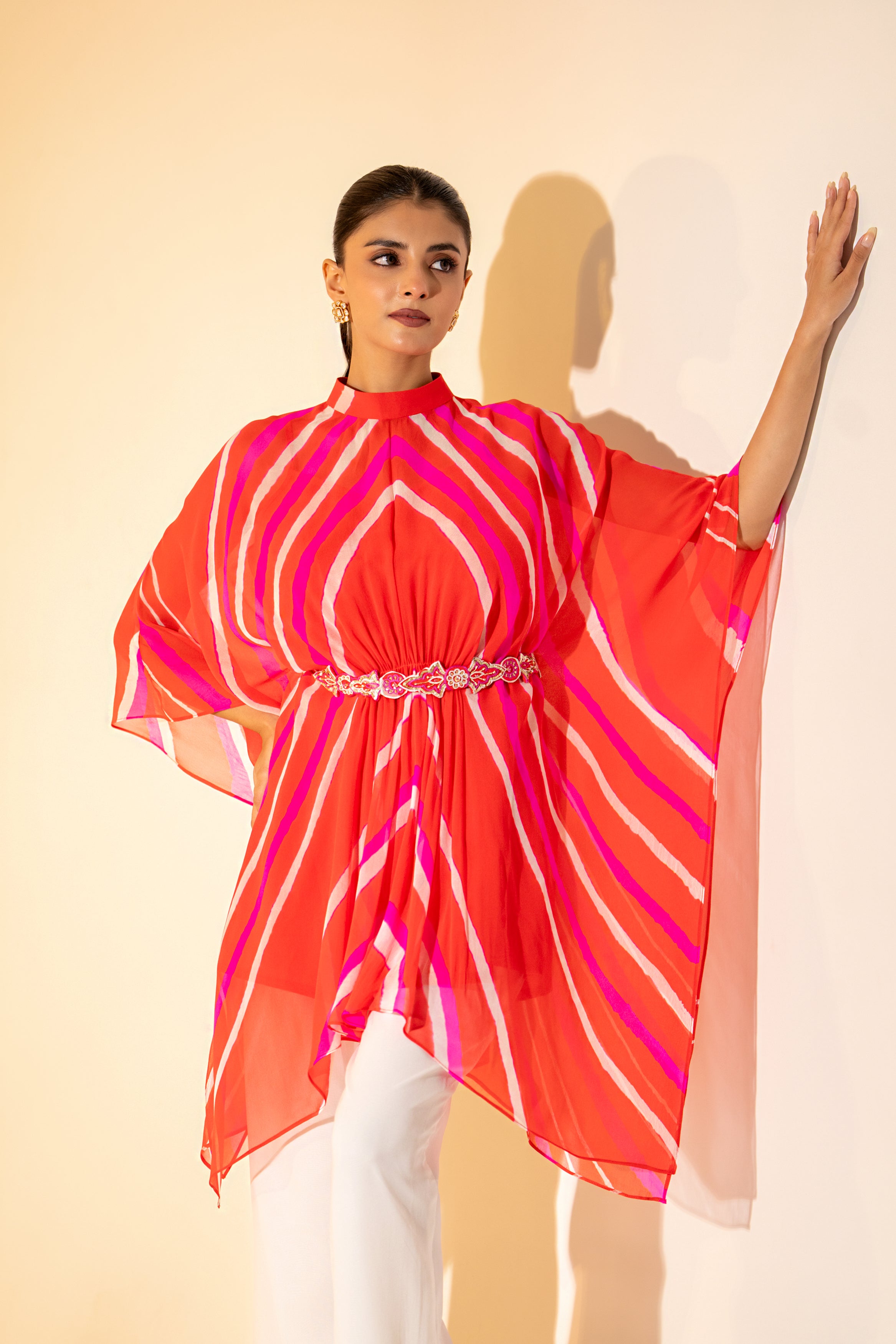 ORANGE LEHERIYA  KAFTAN TOP WITH WHITE PANT  & EMBROIDERED BELT.