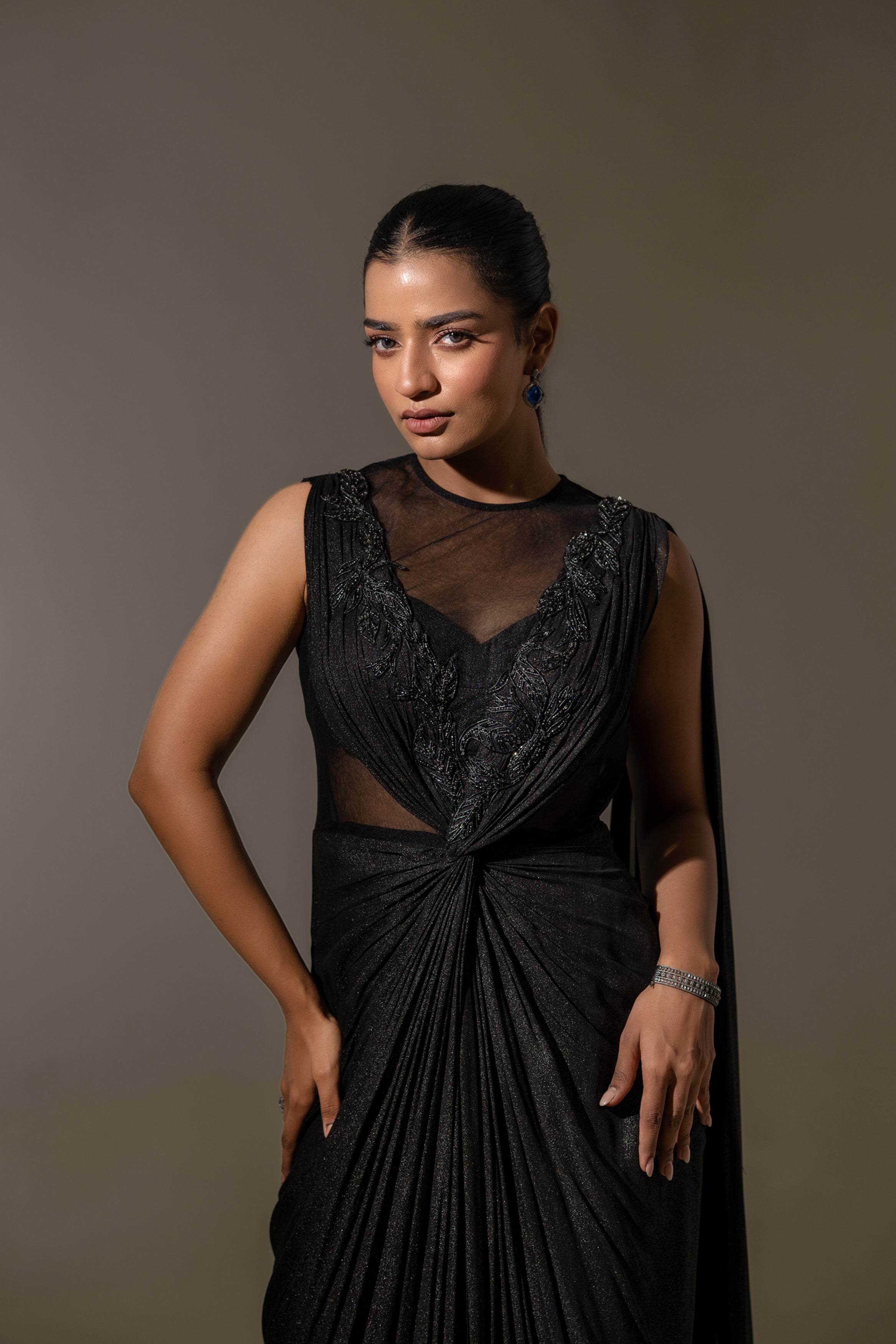 BLACK DRAPED SAREE WITH EMBROIDERY.