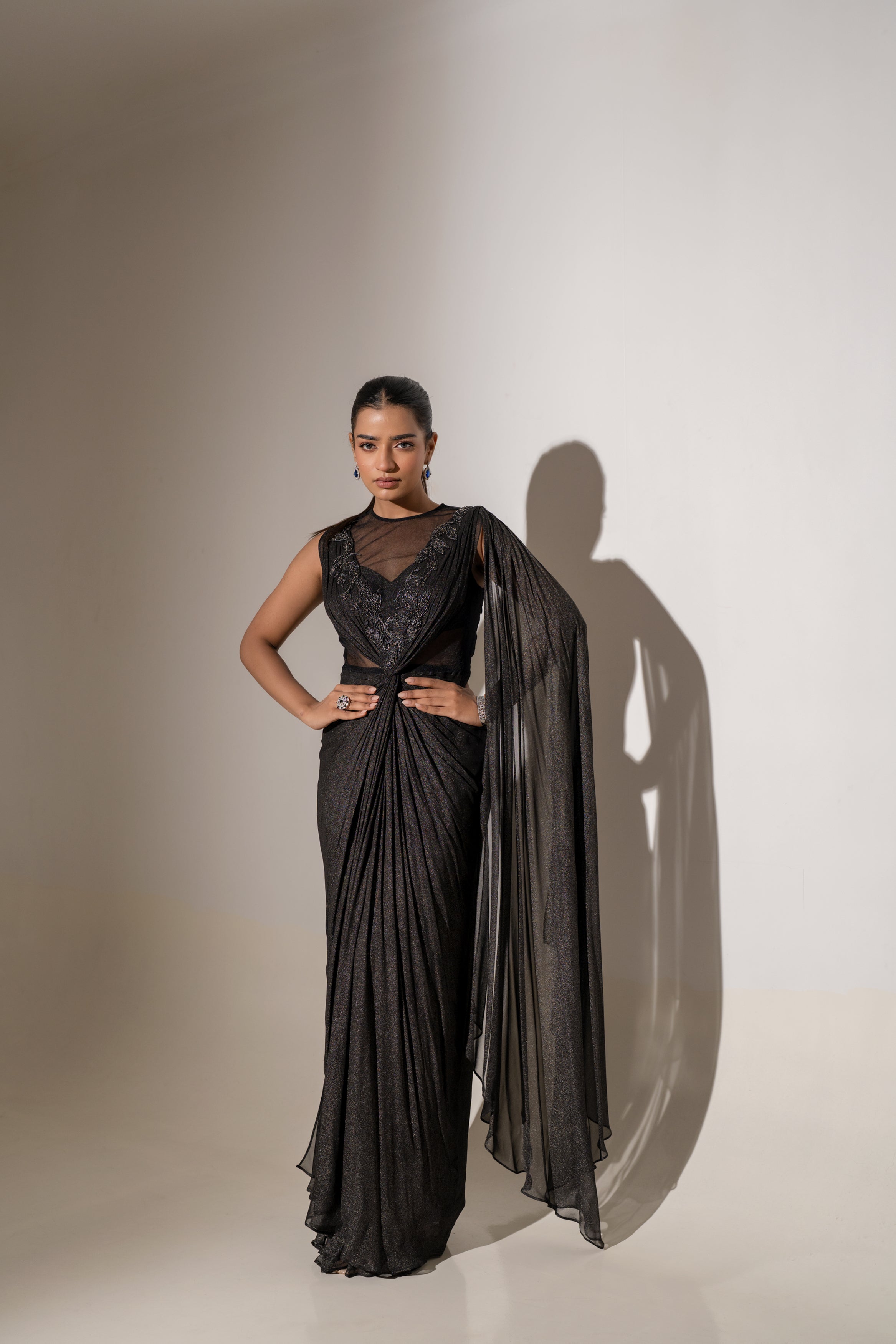 BLACK DRAPED SAREE WITH EMBROIDERY.