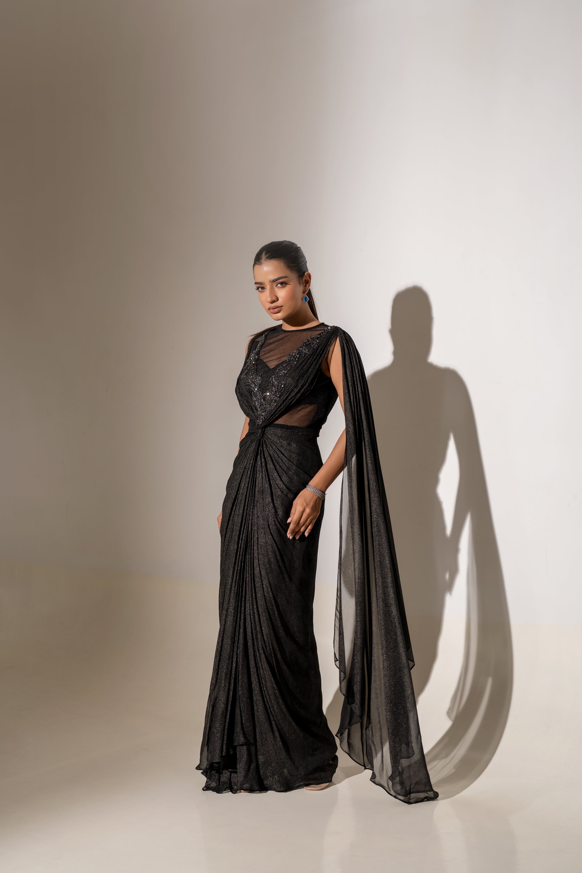 BLACK DRAPED SAREE WITH EMBROIDERY.
