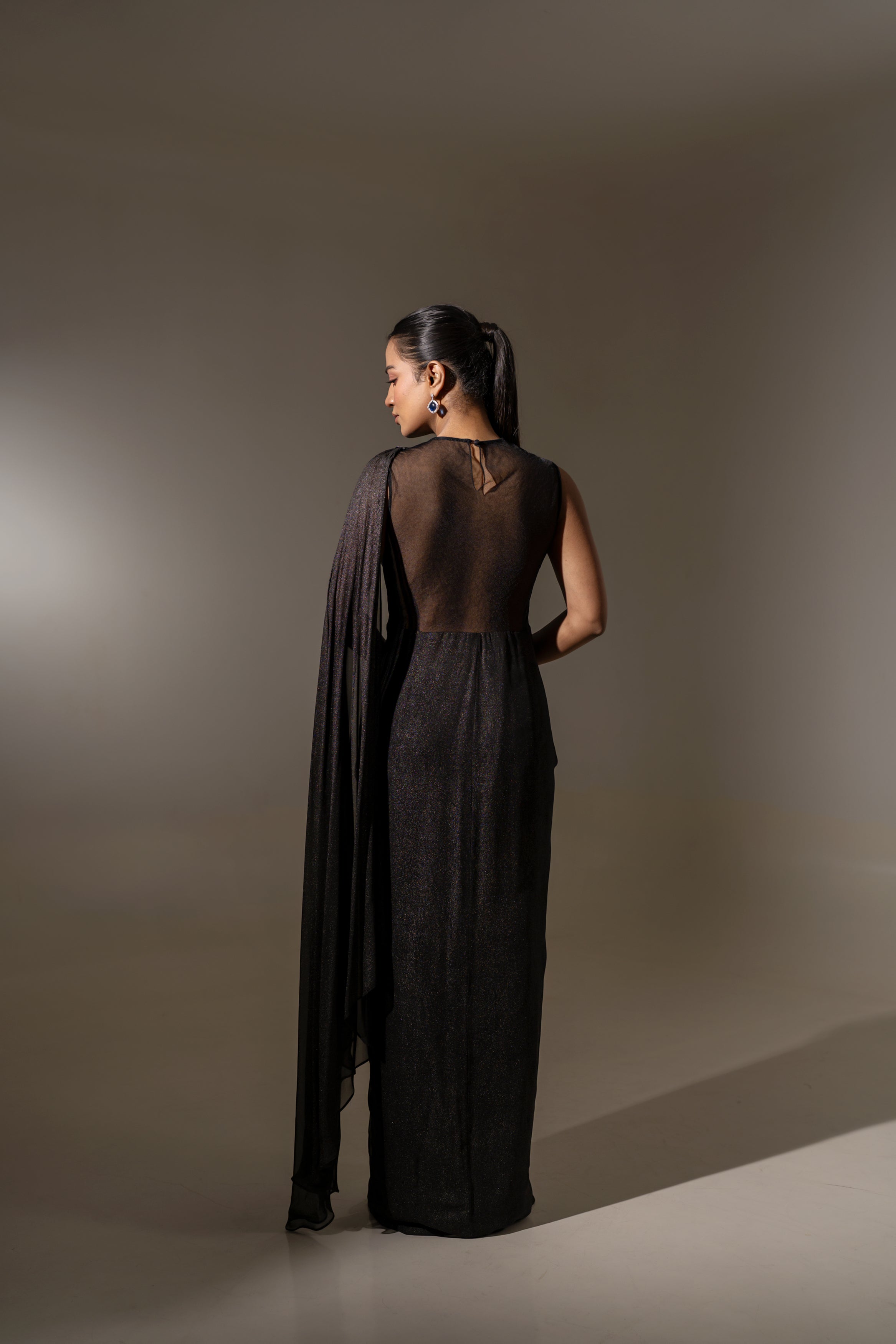 BLACK DRAPED SAREE WITH EMBROIDERY.