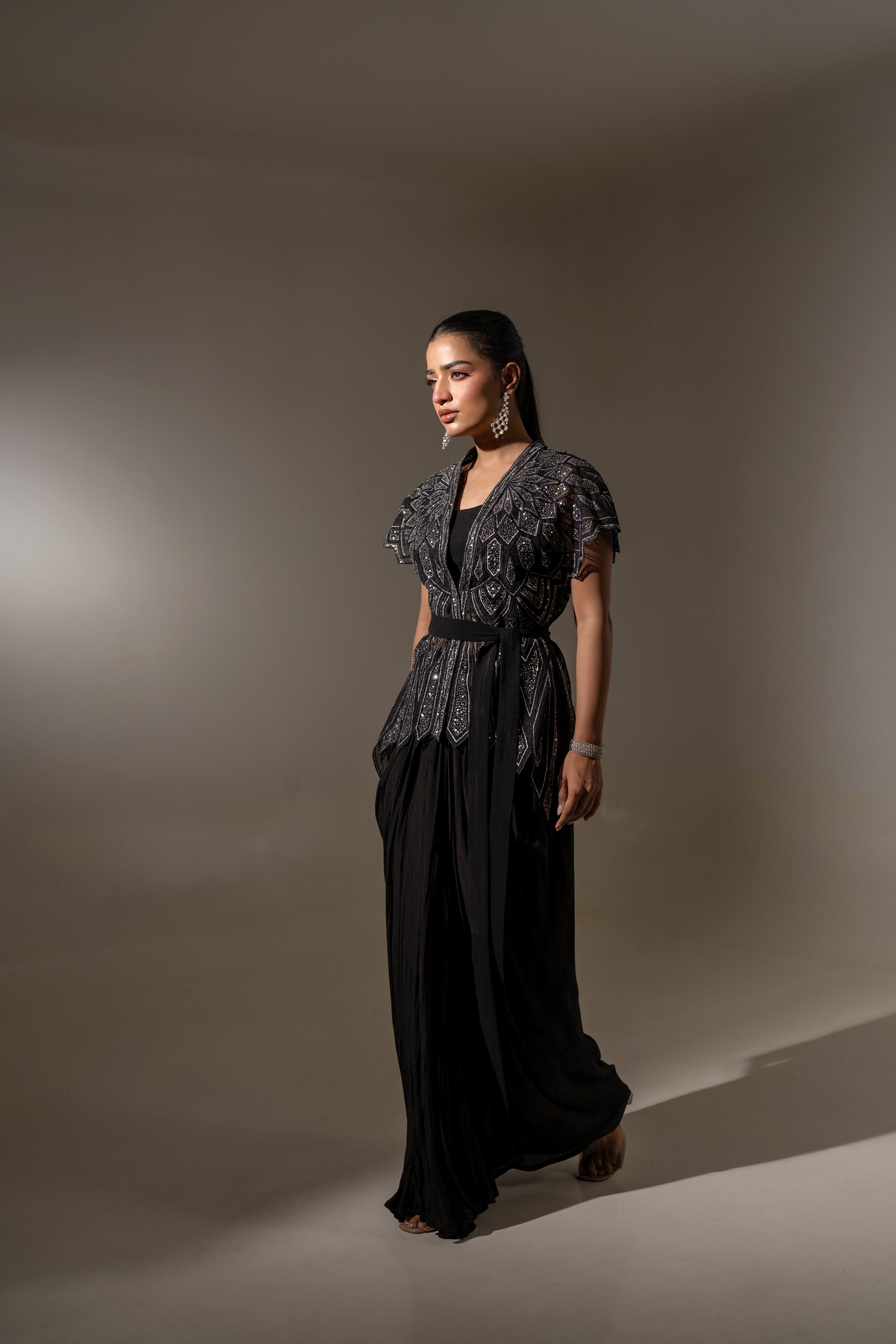 BLACK SKIRT & TOP WITH EMBELLISHED BELTED JACKET.