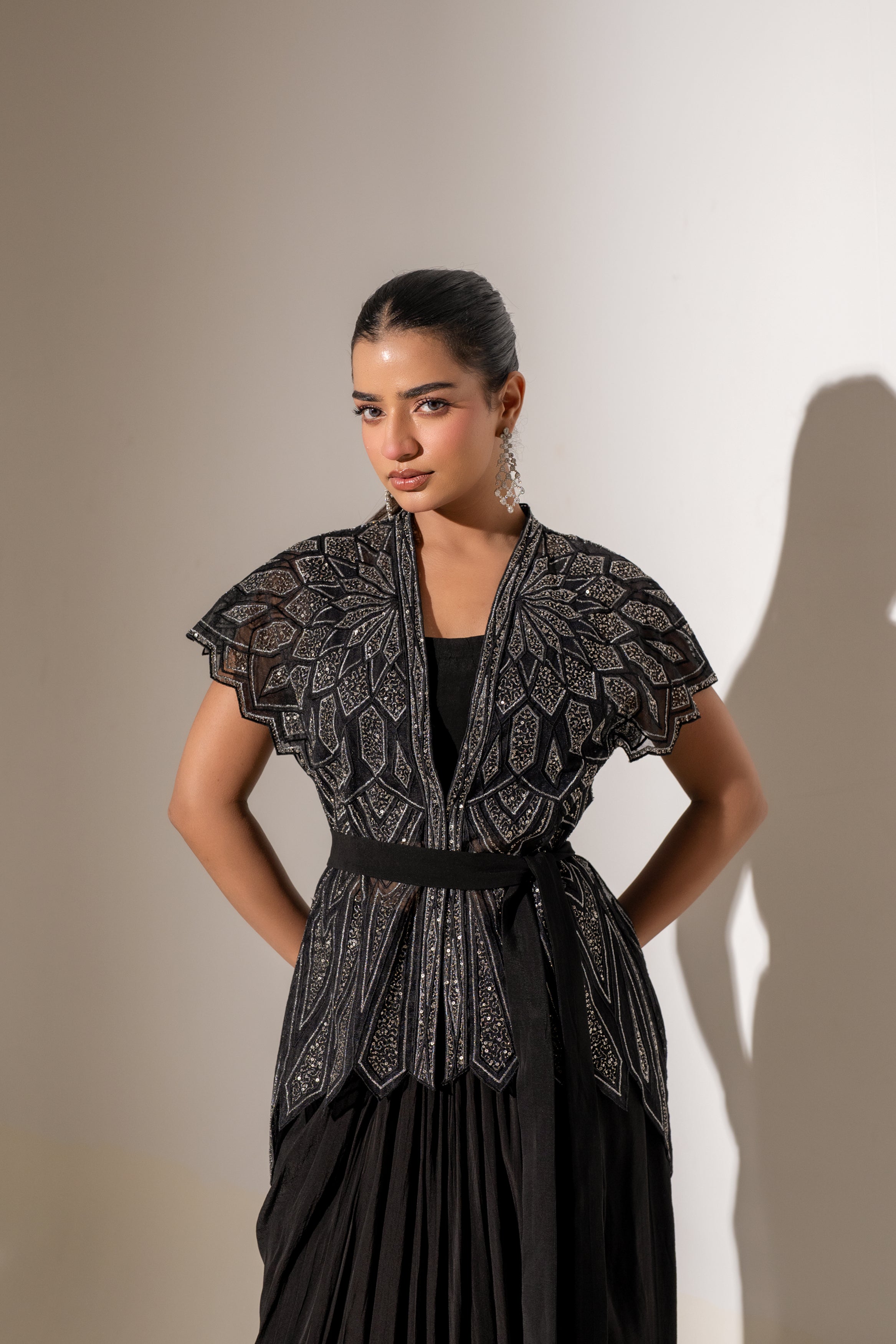 BLACK SKIRT & TOP WITH EMBELLISHED BELTED JACKET.