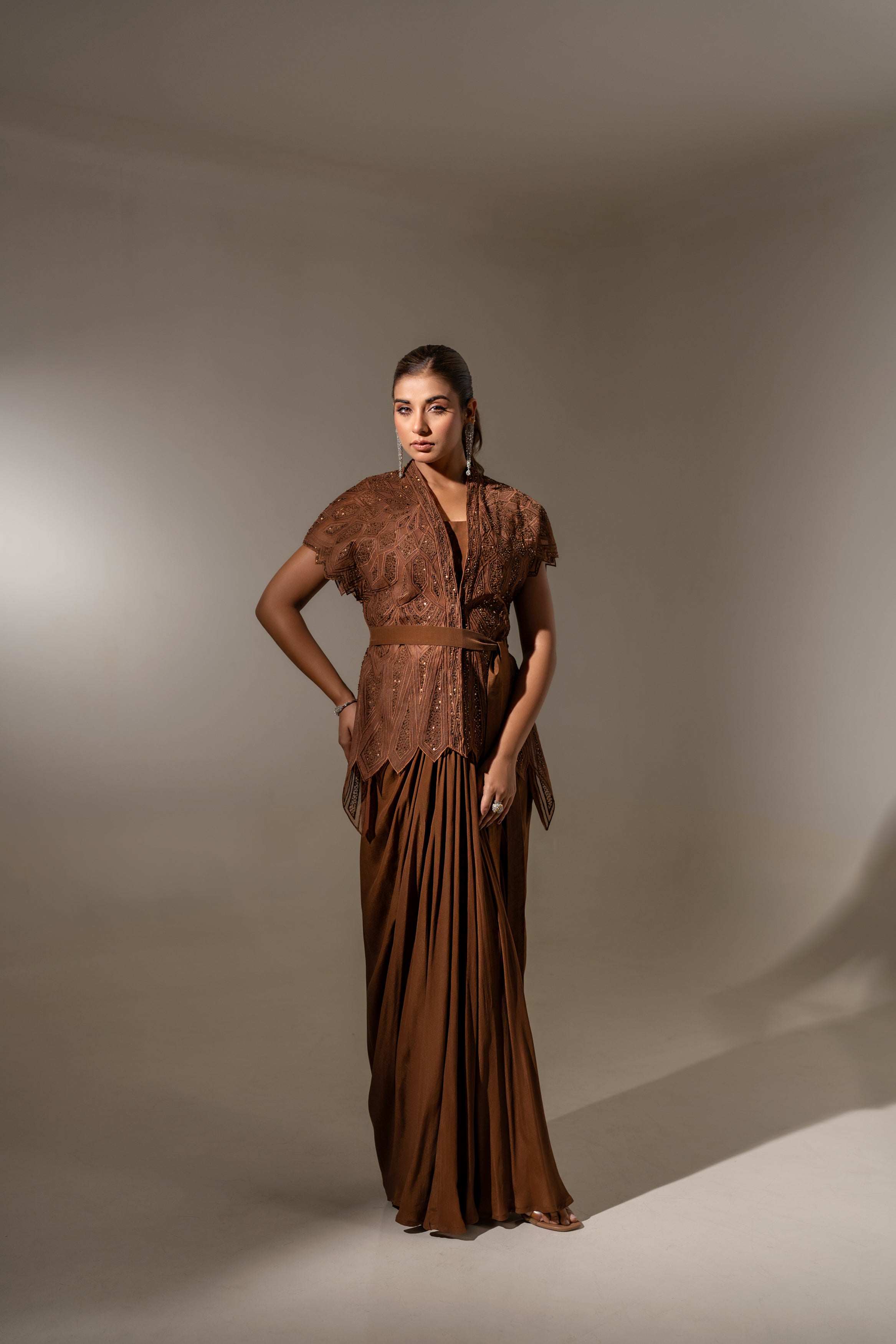 BROWN SKIRT & TOP WITH EMBELLISHED BELTED JACKET.