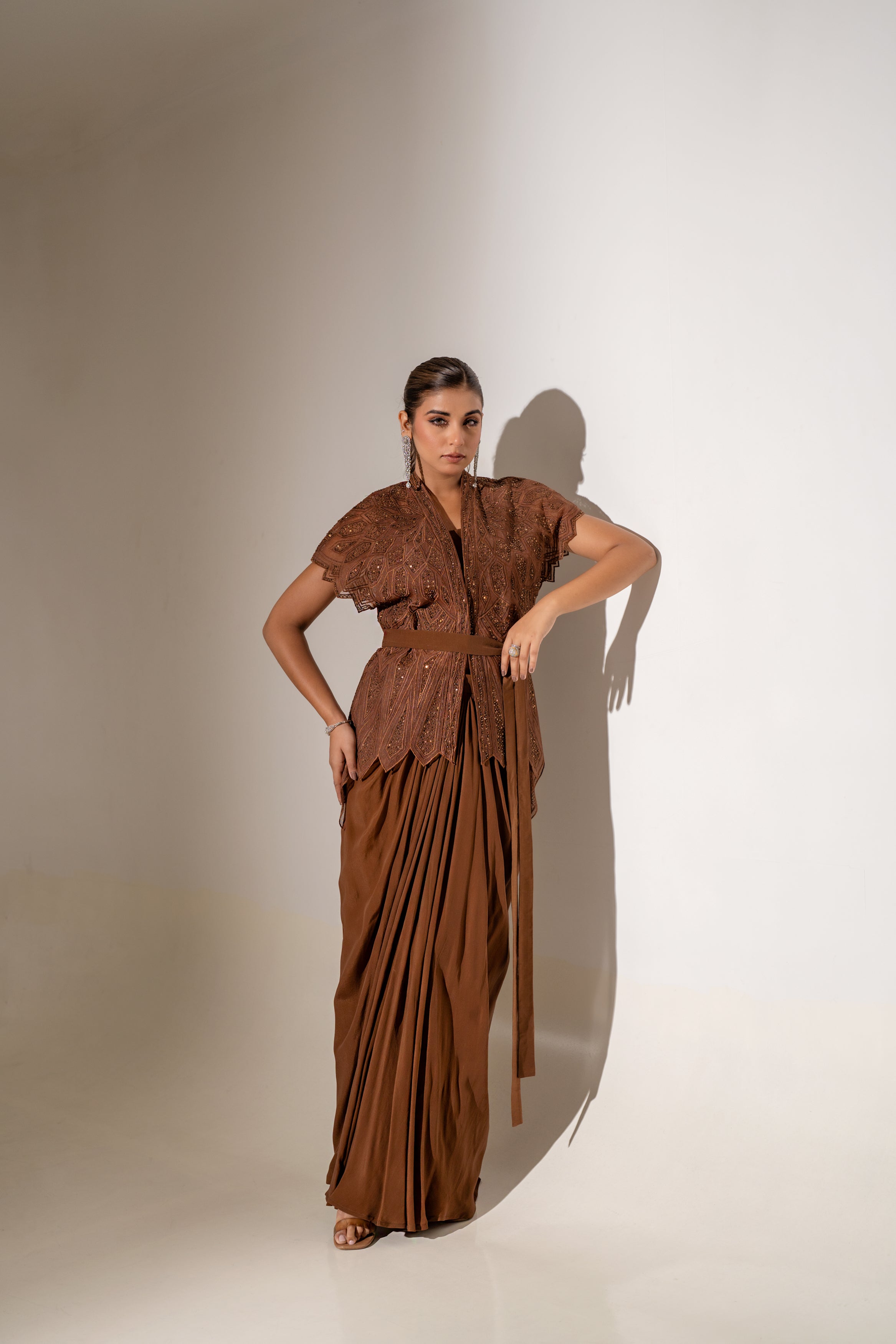 BROWN SKIRT & TOP WITH EMBELLISHED BELTED JACKET.