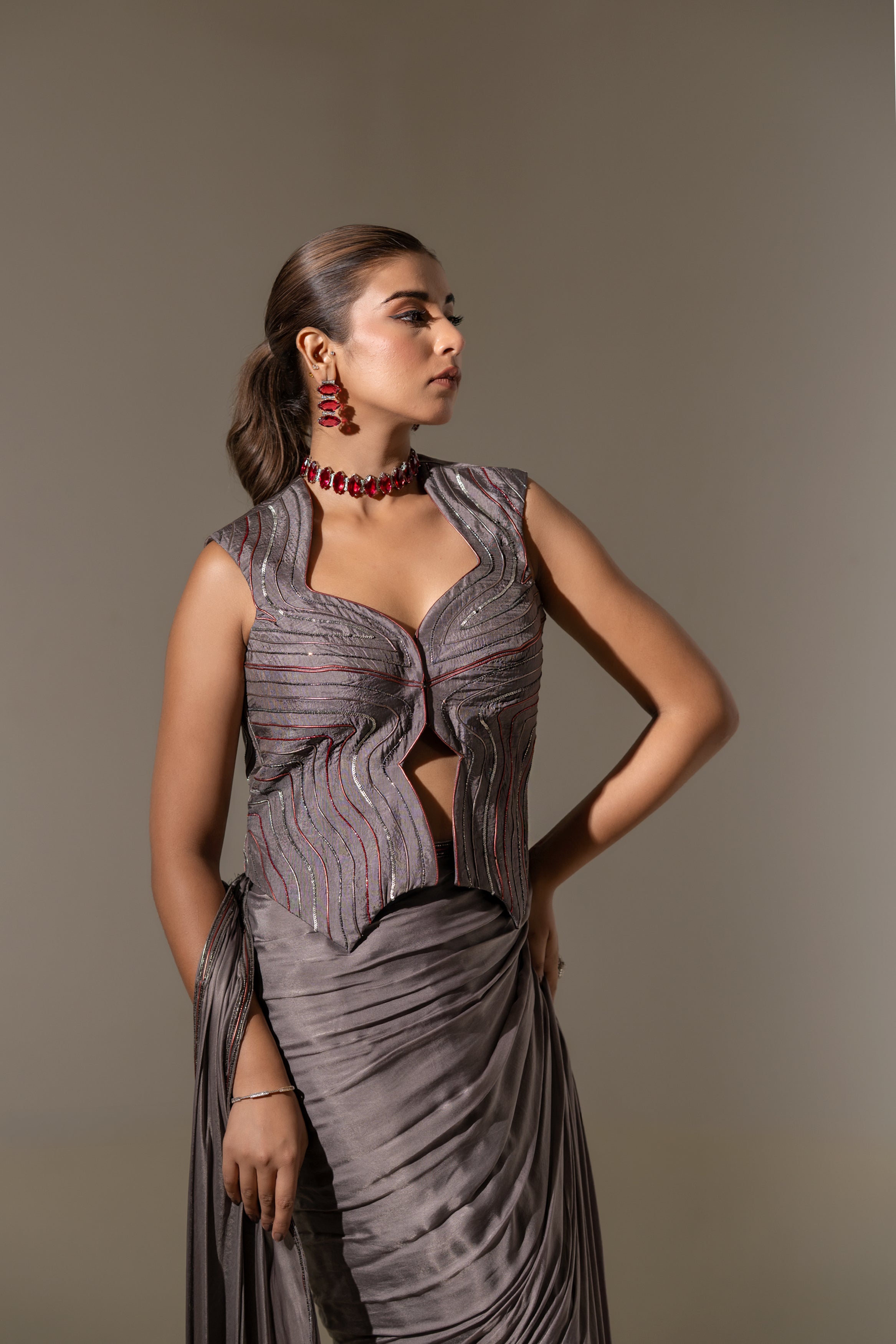 GREY SEQUIN AND EMBELLISHED PRE-DRAPED SAREE WITH DESIGNER CUT-OUT BLOUSE.