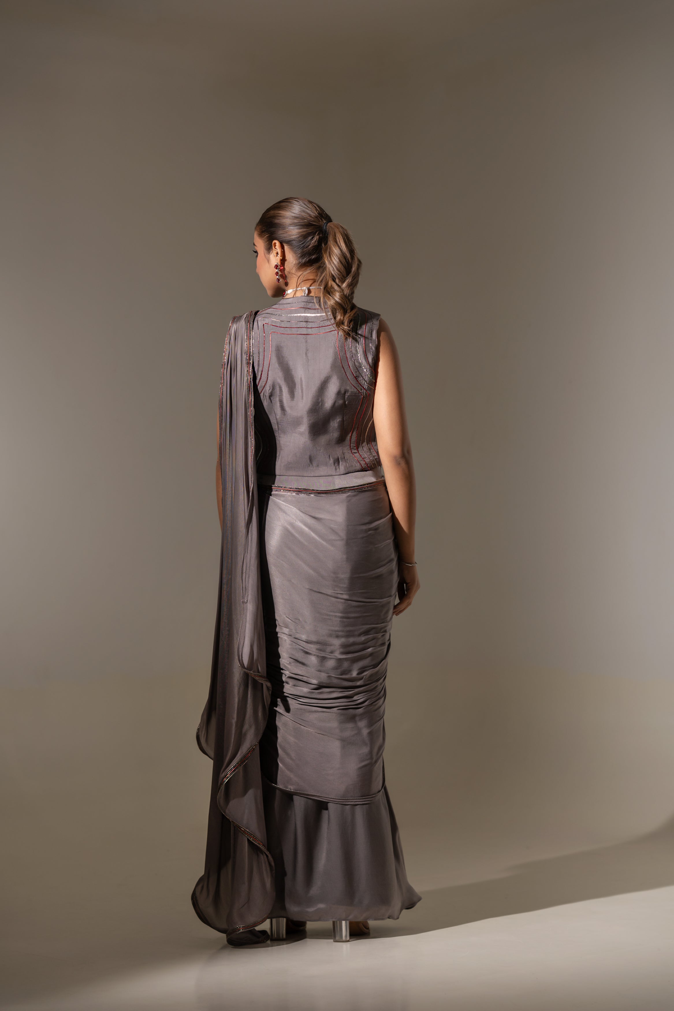 GREY SEQUIN AND EMBELLISHED PRE-DRAPED SAREE WITH DESIGNER CUT-OUT BLOUSE.