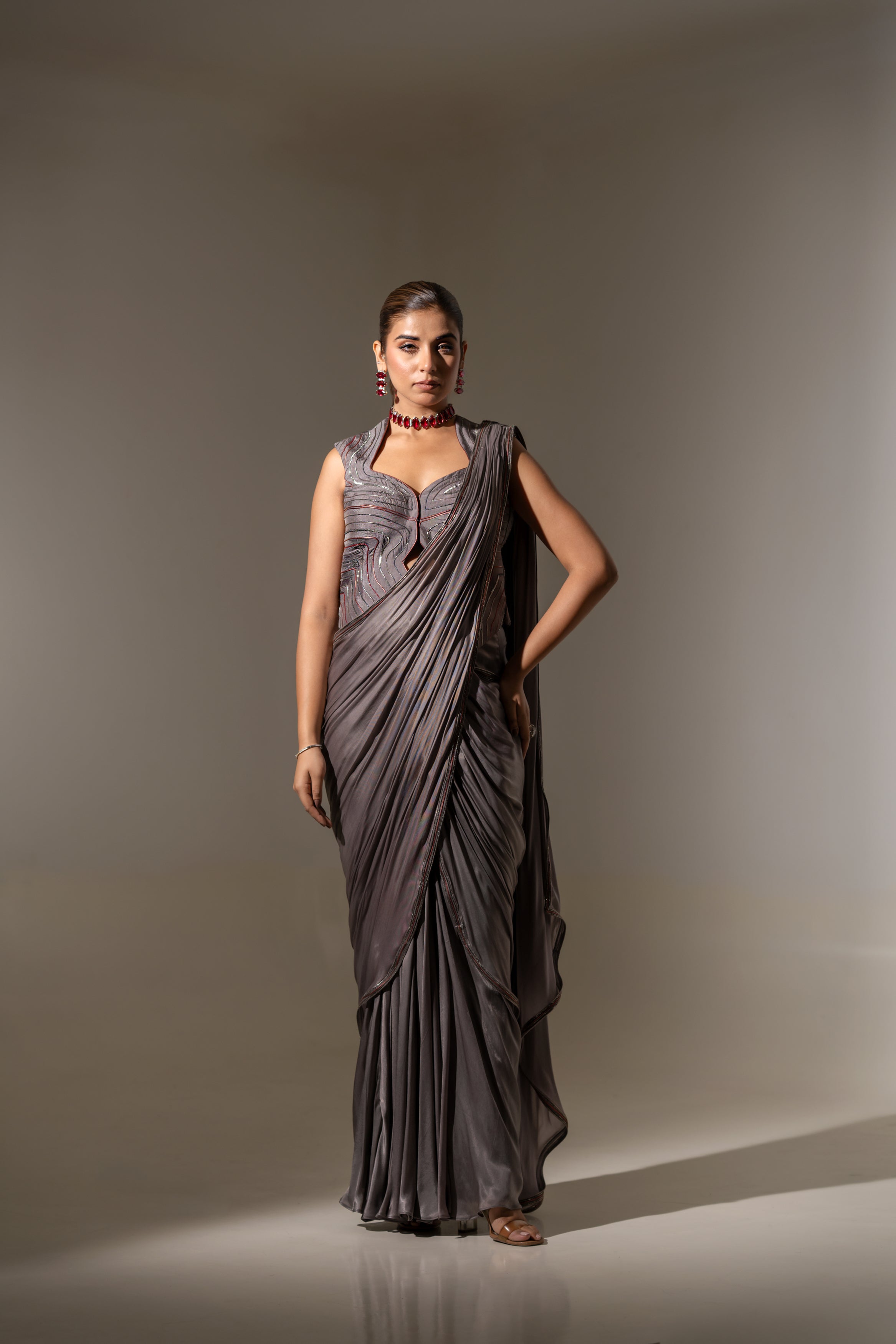 GREY SEQUIN AND EMBELLISHED PRE-DRAPED SAREE WITH DESIGNER CUT-OUT BLOUSE.