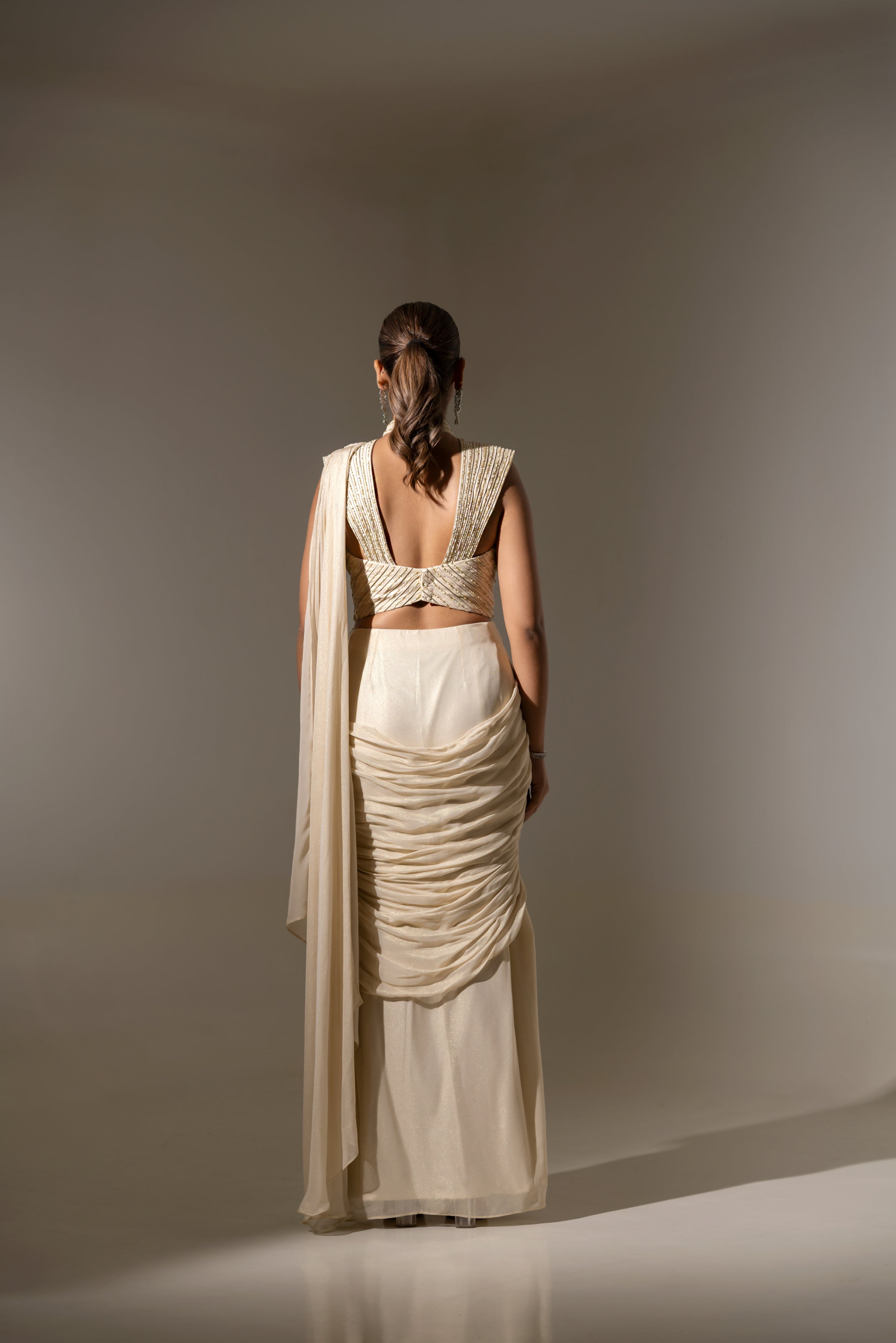 OFF WHITE DRAPE SAREE WITH HAND-EMBELLISHED DETAILING ON THE BLOUSE