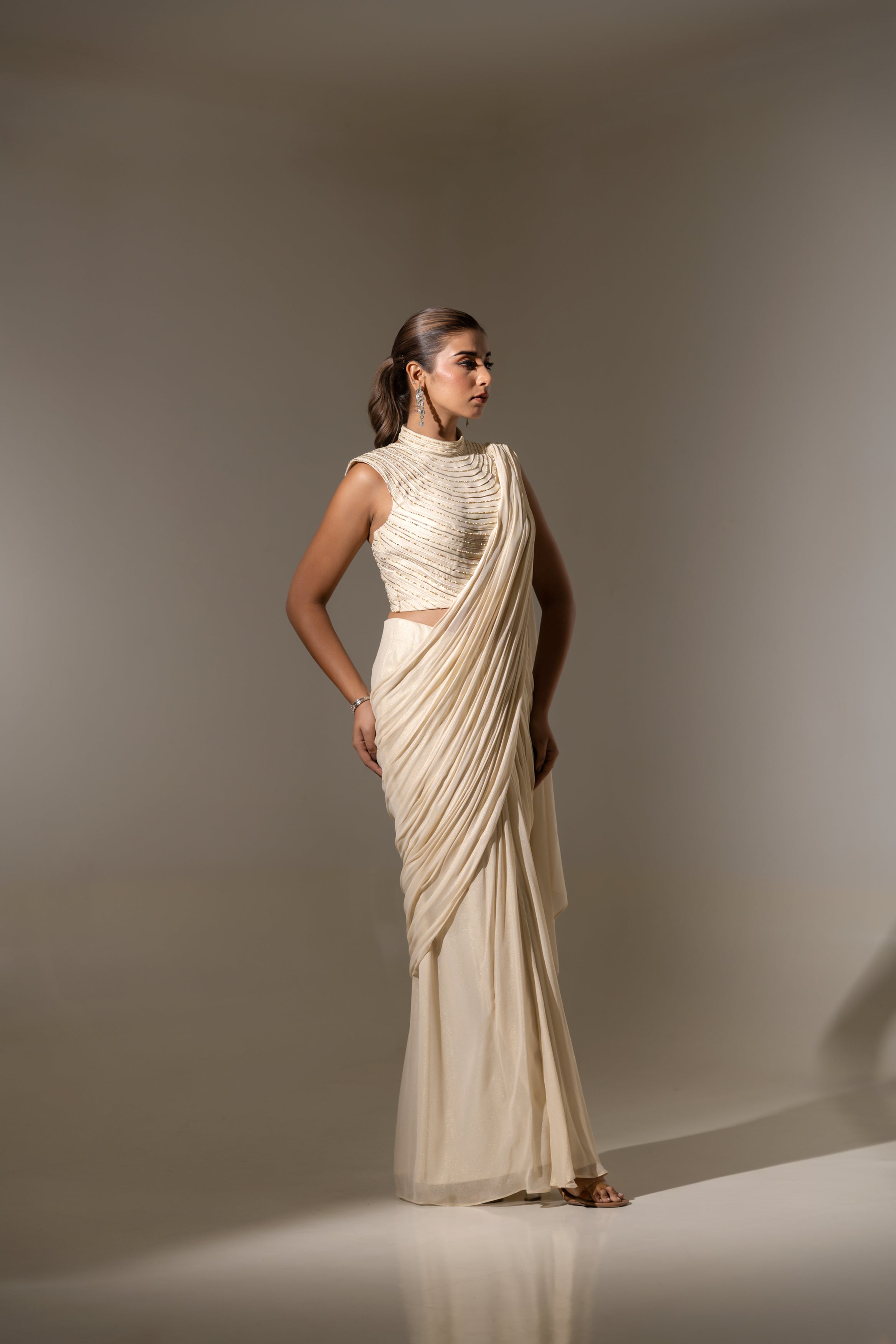 OFF WHITE DRAPE SAREE WITH HAND-EMBELLISHED DETAILING ON THE BLOUSE
