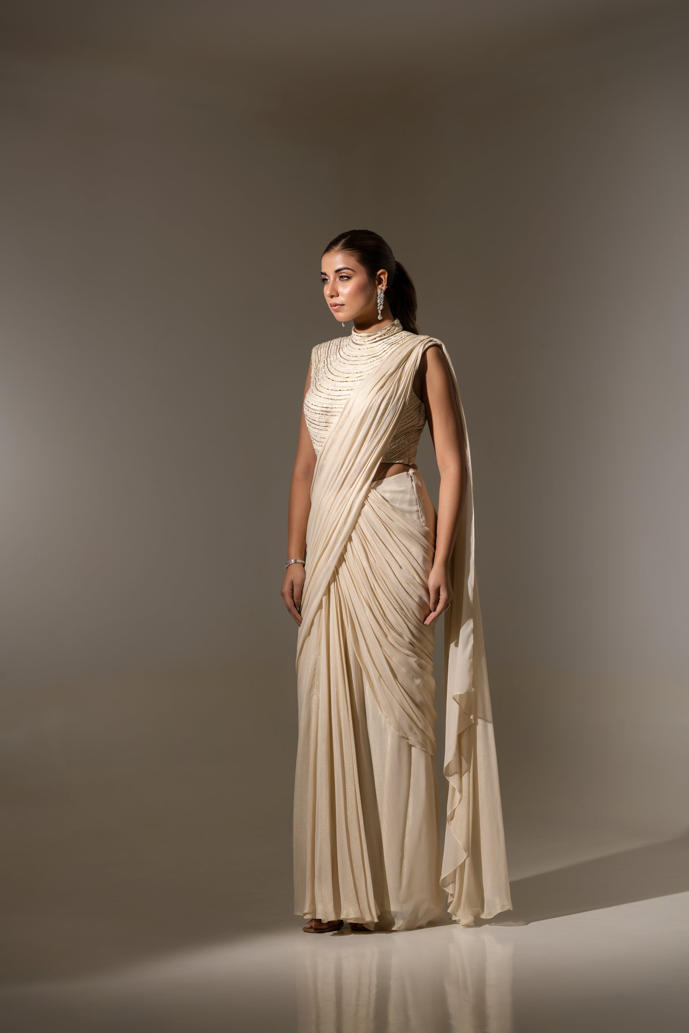 OFF WHITE DRAPE SAREE WITH HAND-EMBELLISHED DETAILING ON THE BLOUSE