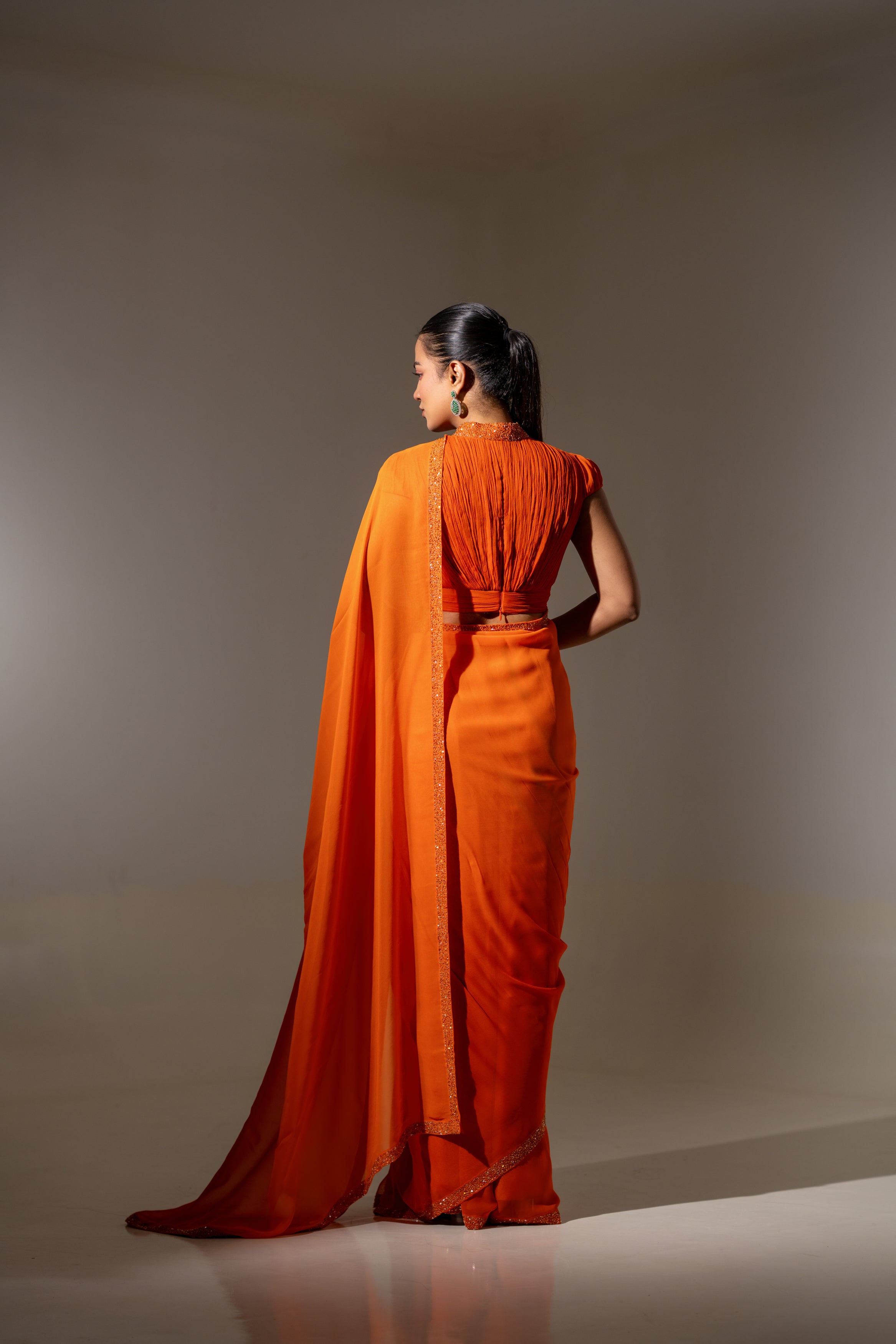ORANGE DRAPED BLOUSE WITH OMBRE  SAREE.