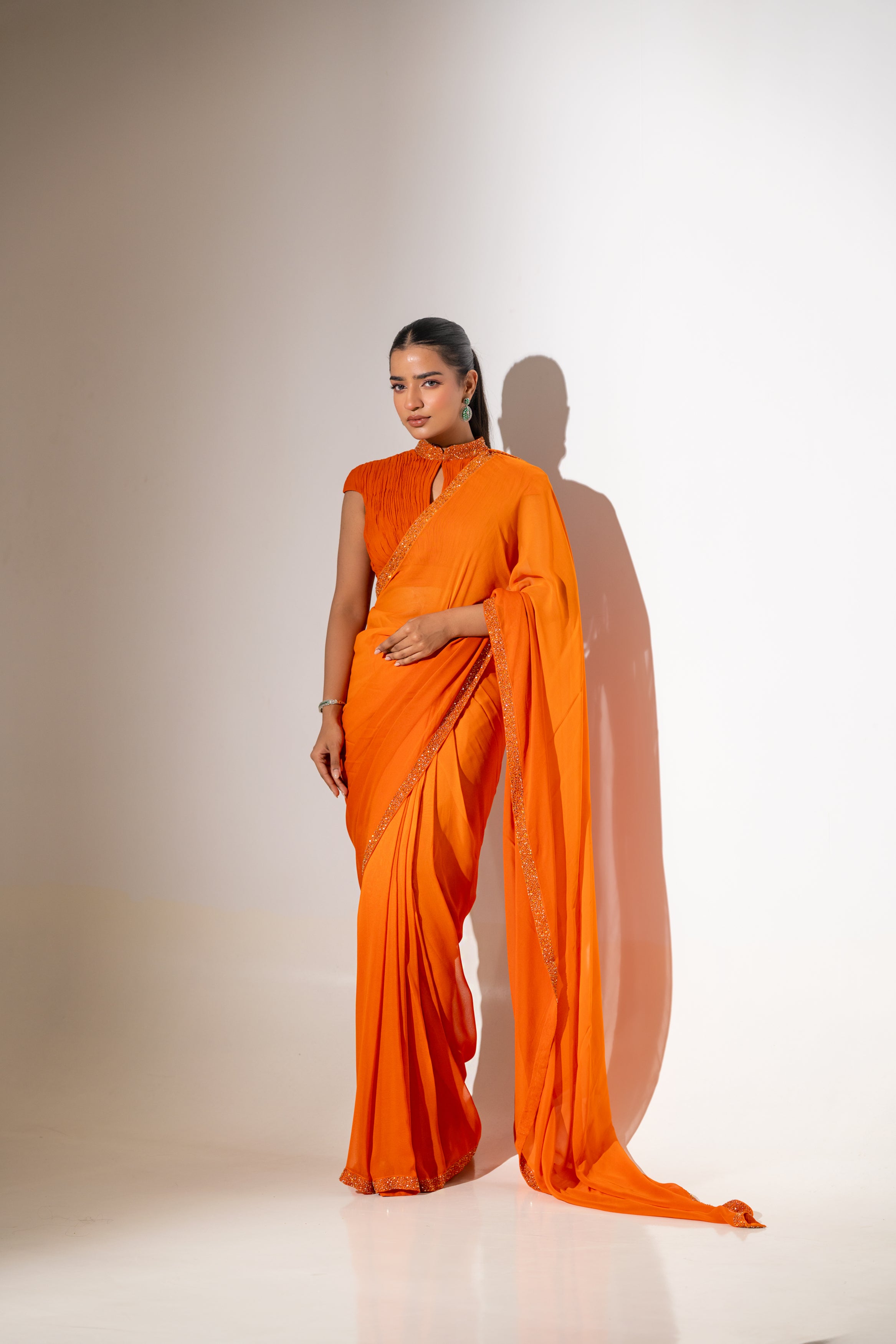 ORANGE DRAPED BLOUSE WITH OMBRE  SAREE.