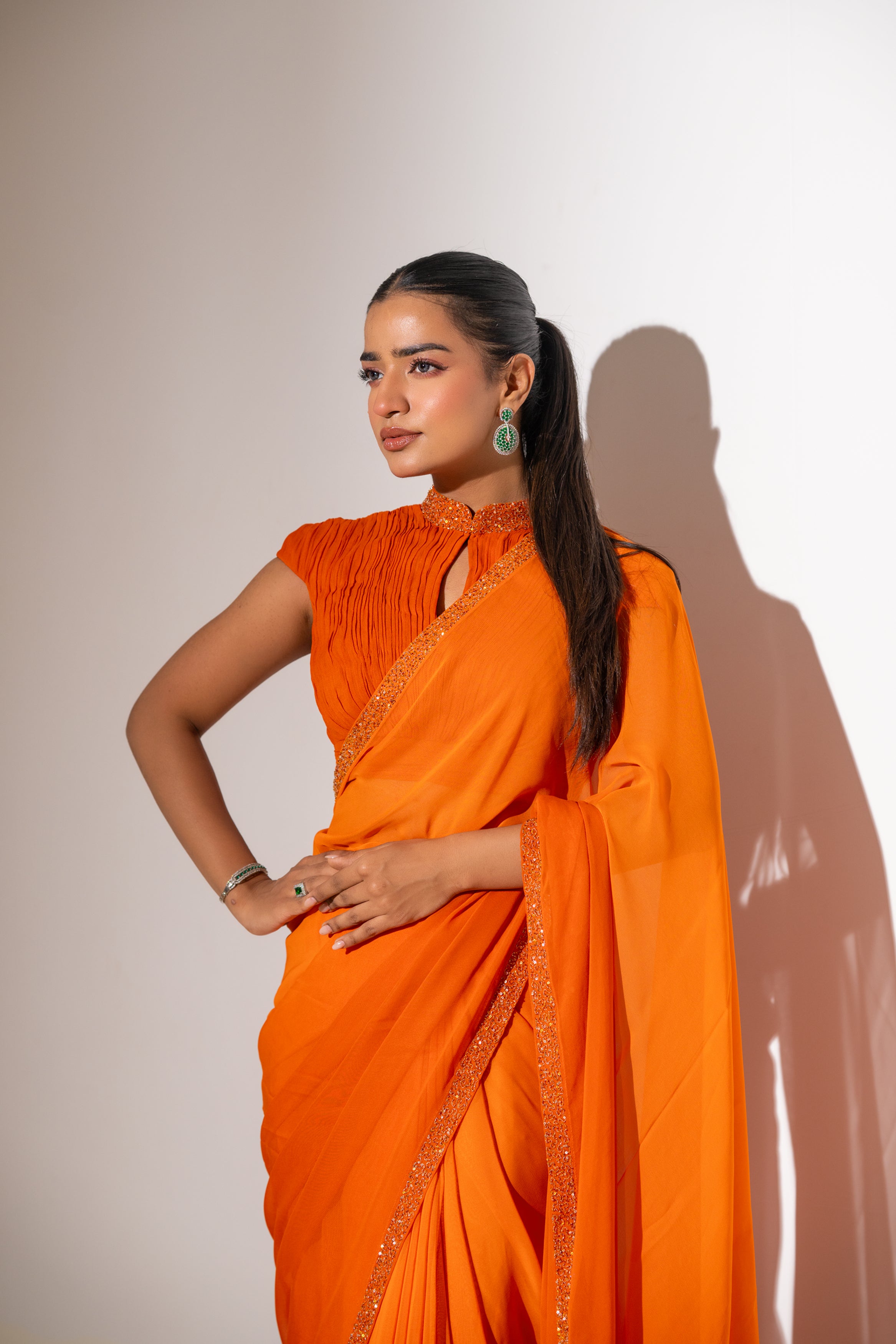 ORANGE DRAPED BLOUSE WITH OMBRE  SAREE.
