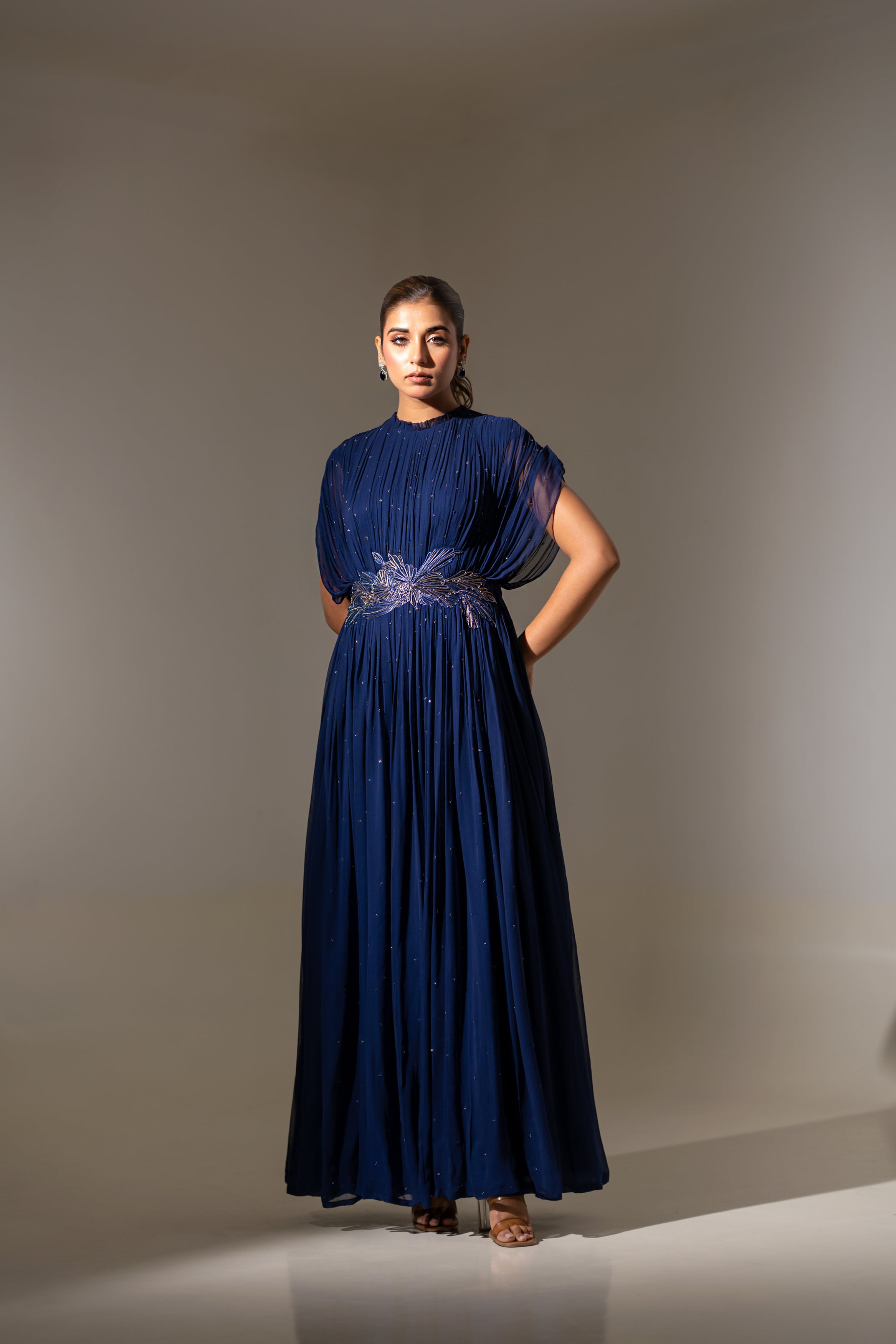 BLUE WIRE EMBELLISHED PLEATED GOWN WITH SHEER SLEEVES.