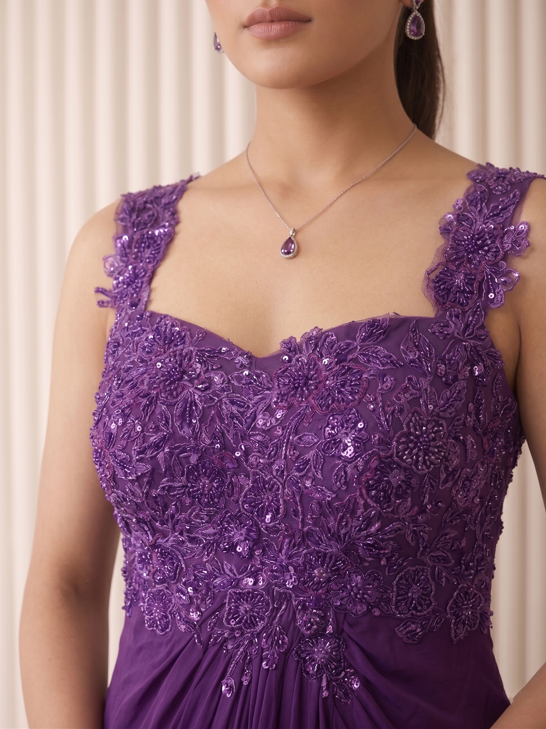 ELEGANT PURPLE EMBROIDERED DRAPED GOWN.