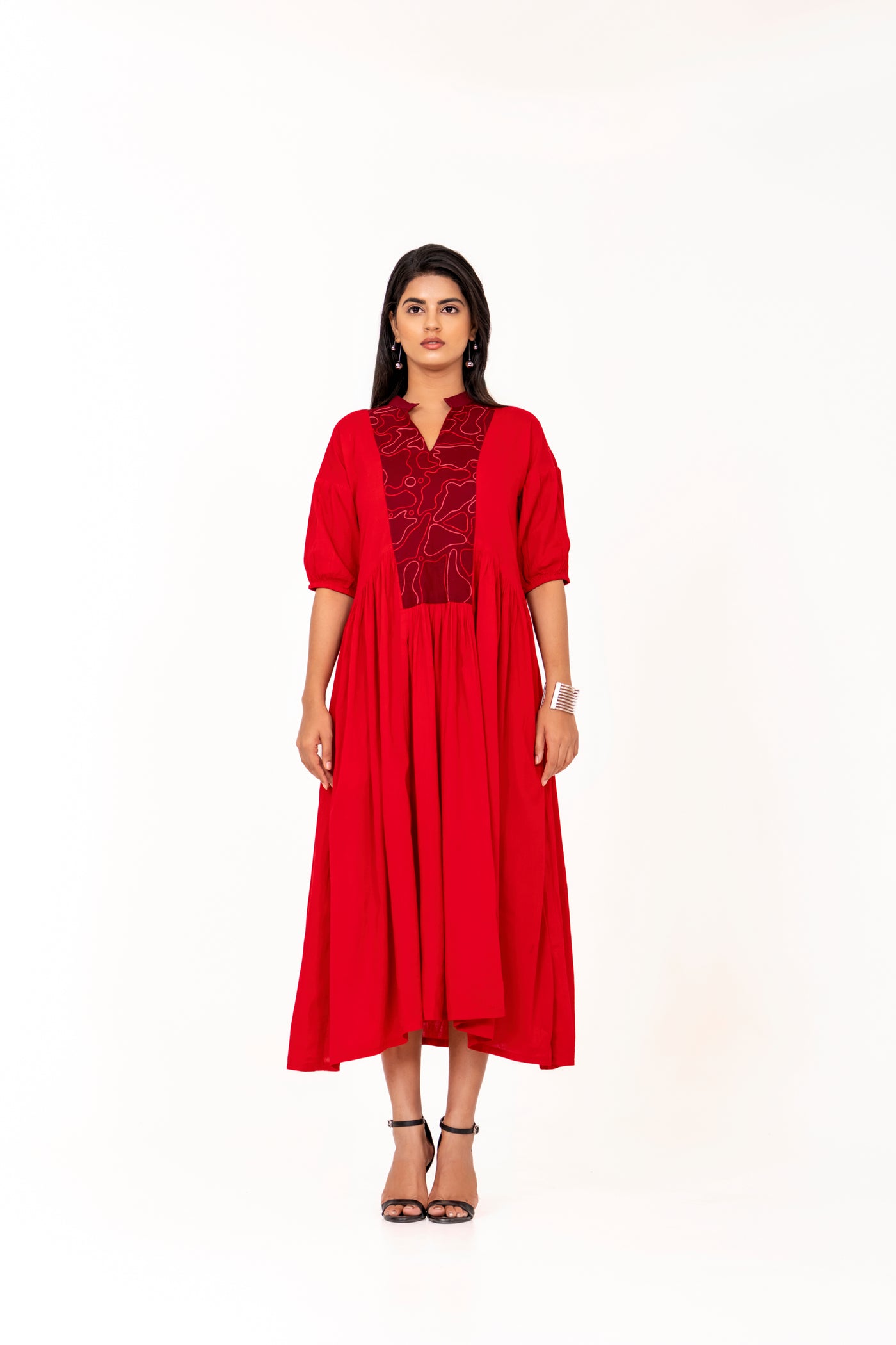 RED FLARED MIDI DRESS WITH PUFF SLEEVES AND EMBROIDERED YOKE. K.Anshika RED FLARED MIDI DRESS WITH PUFF SLEEVES AND EMBROIDERED YOKE. K.Anshika