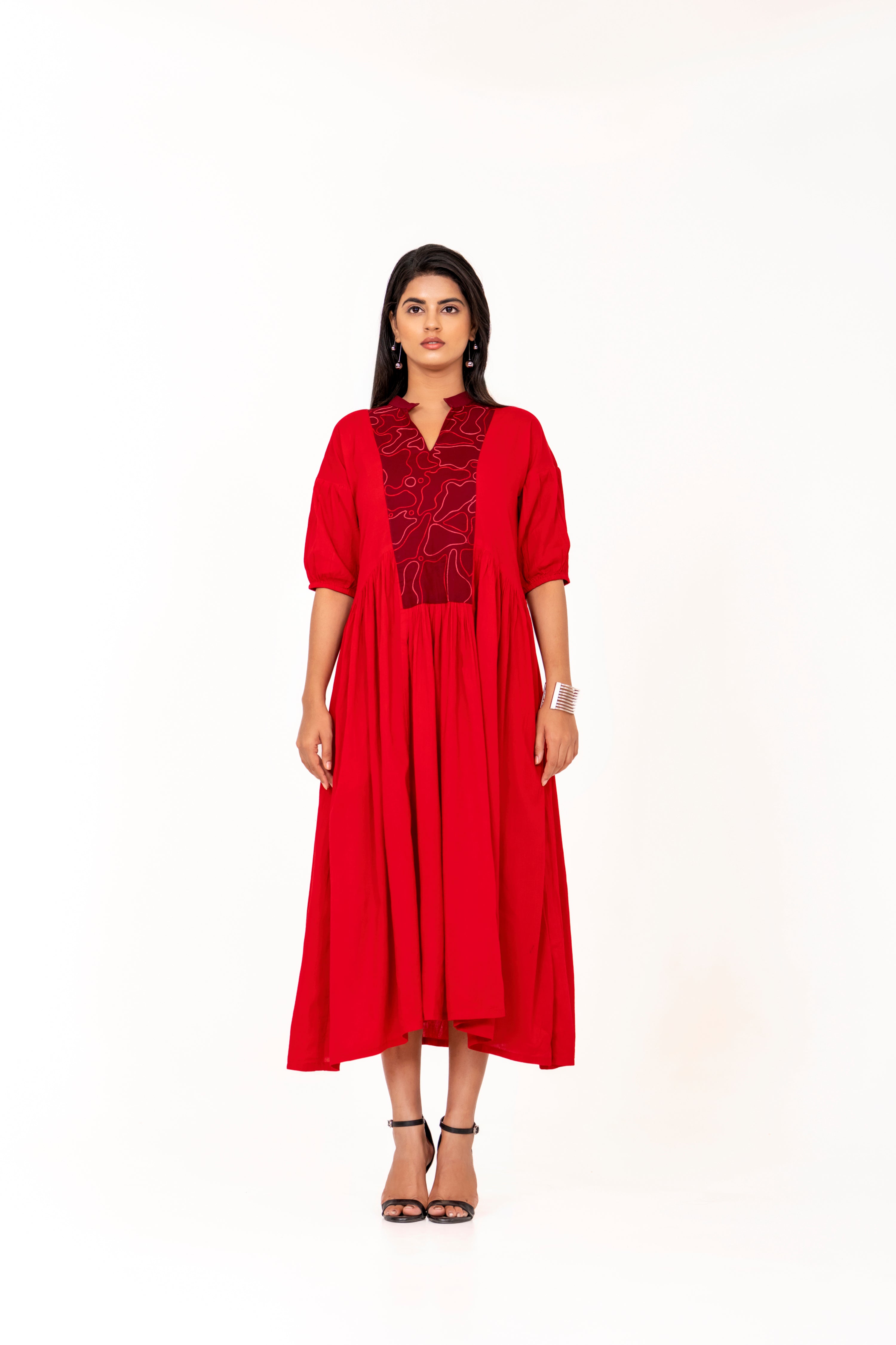RED FLARED MIDI DRESS WITH PUFF SLEEVES AND EMBROIDERED YOKE.