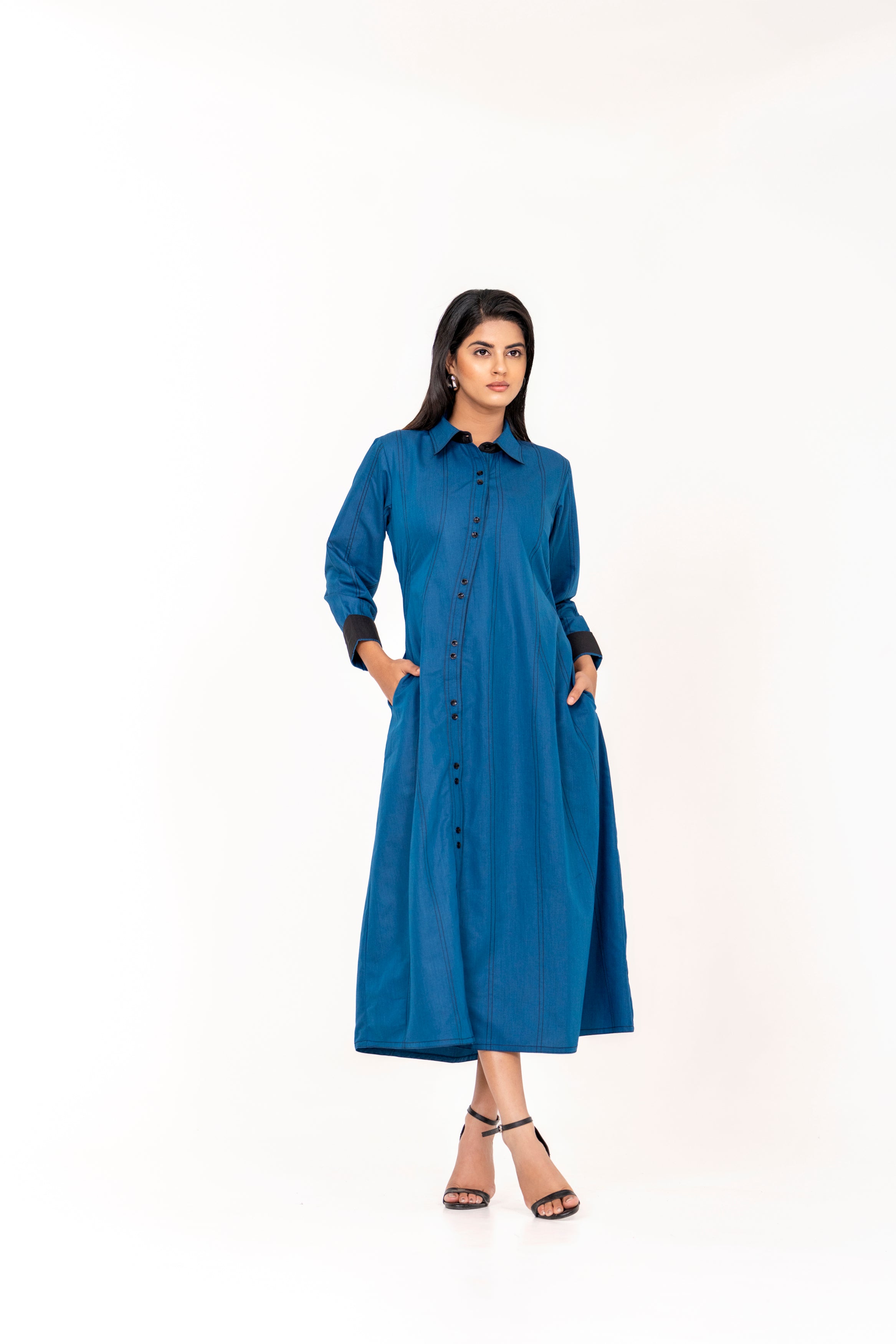 ELEGANT BLUE SHIRT STYLE A-LINE DRESS WITH FRONT BUTTONS AND CONTRAST CUFFS.