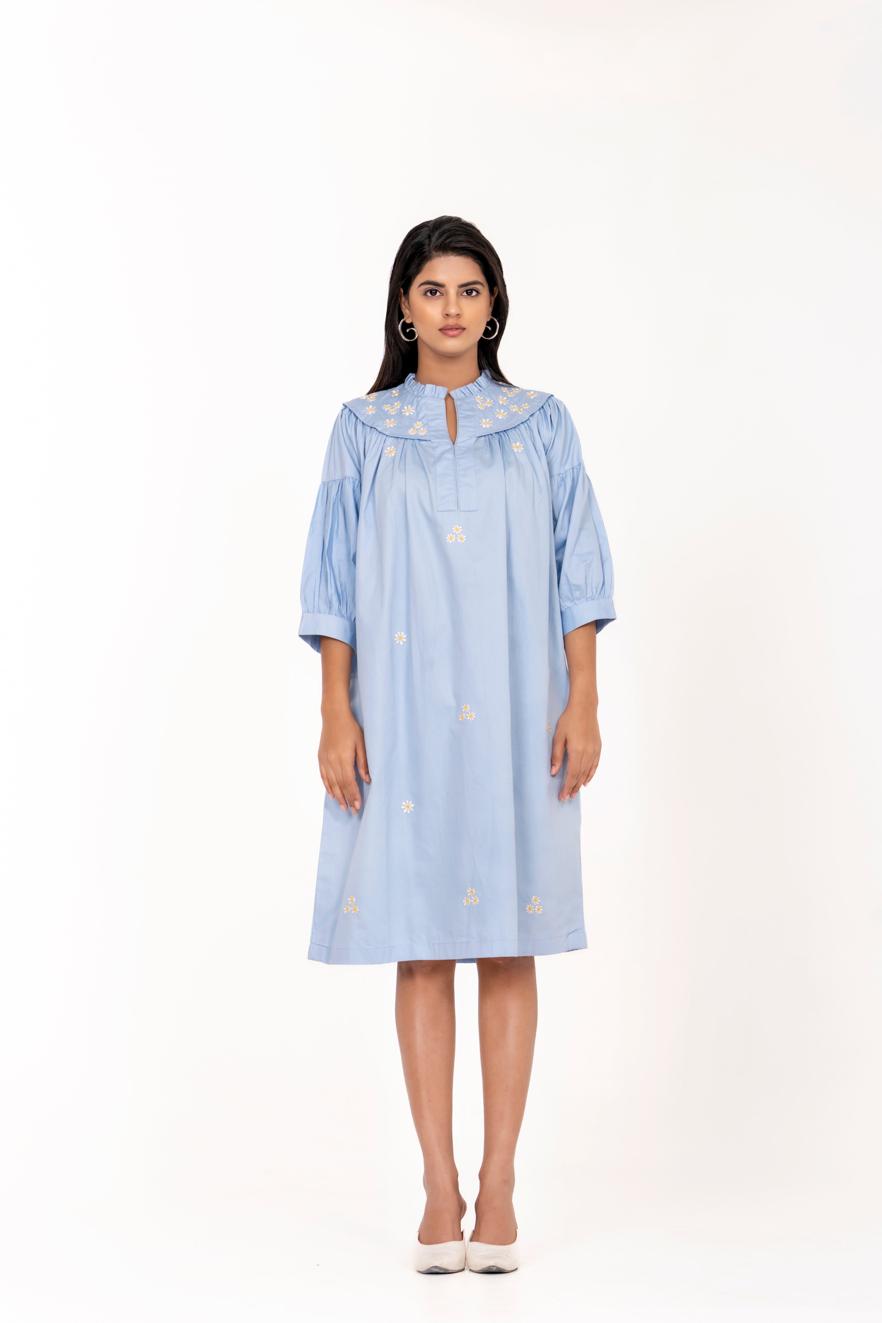 SKY BLUE EMBROIDERED DRESS WITH FLORAL DETAILING AND PUFFED SLEEVES.