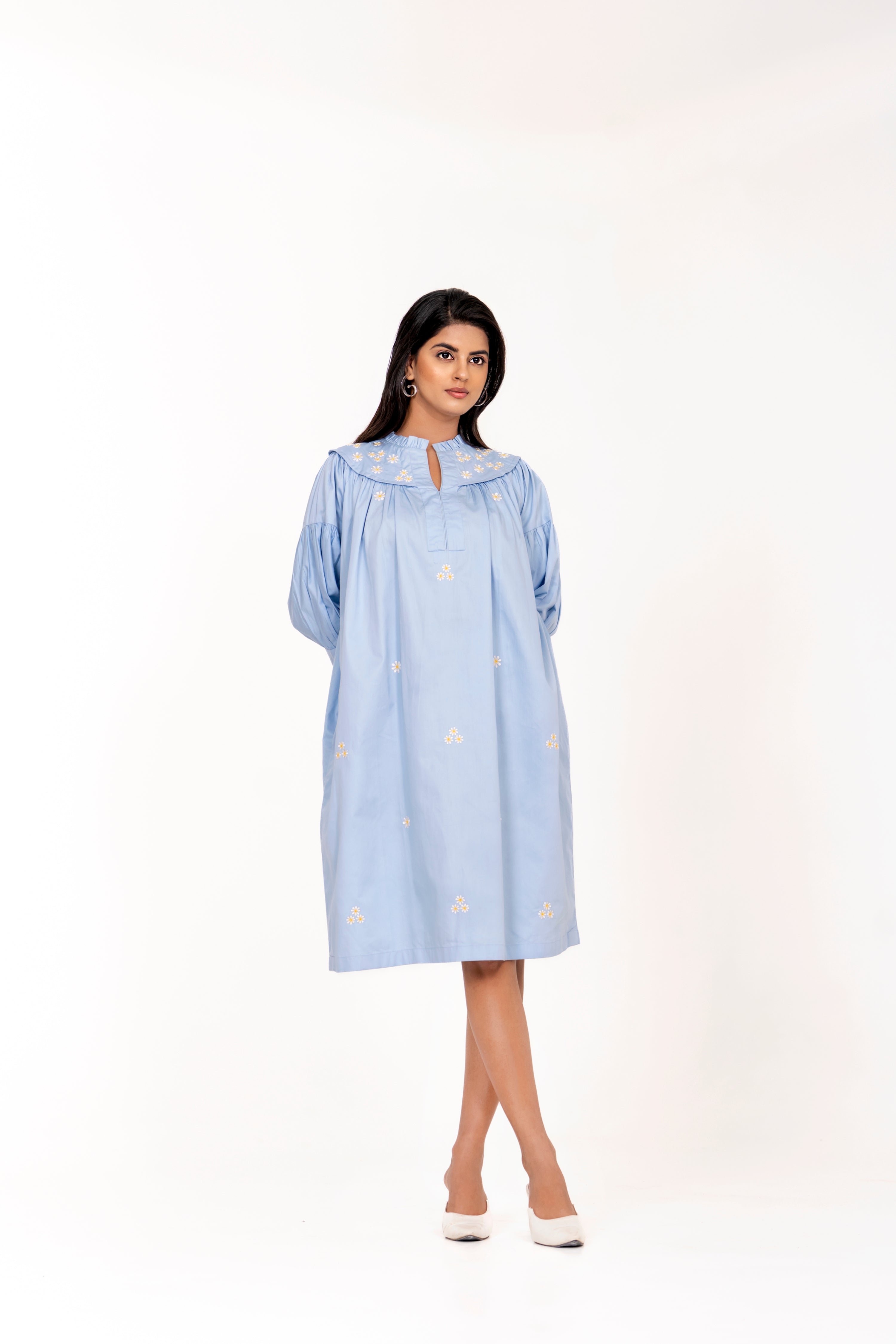 SKY BLUE EMBROIDERED DRESS WITH FLORAL DETAILING AND PUFFED SLEEVES.