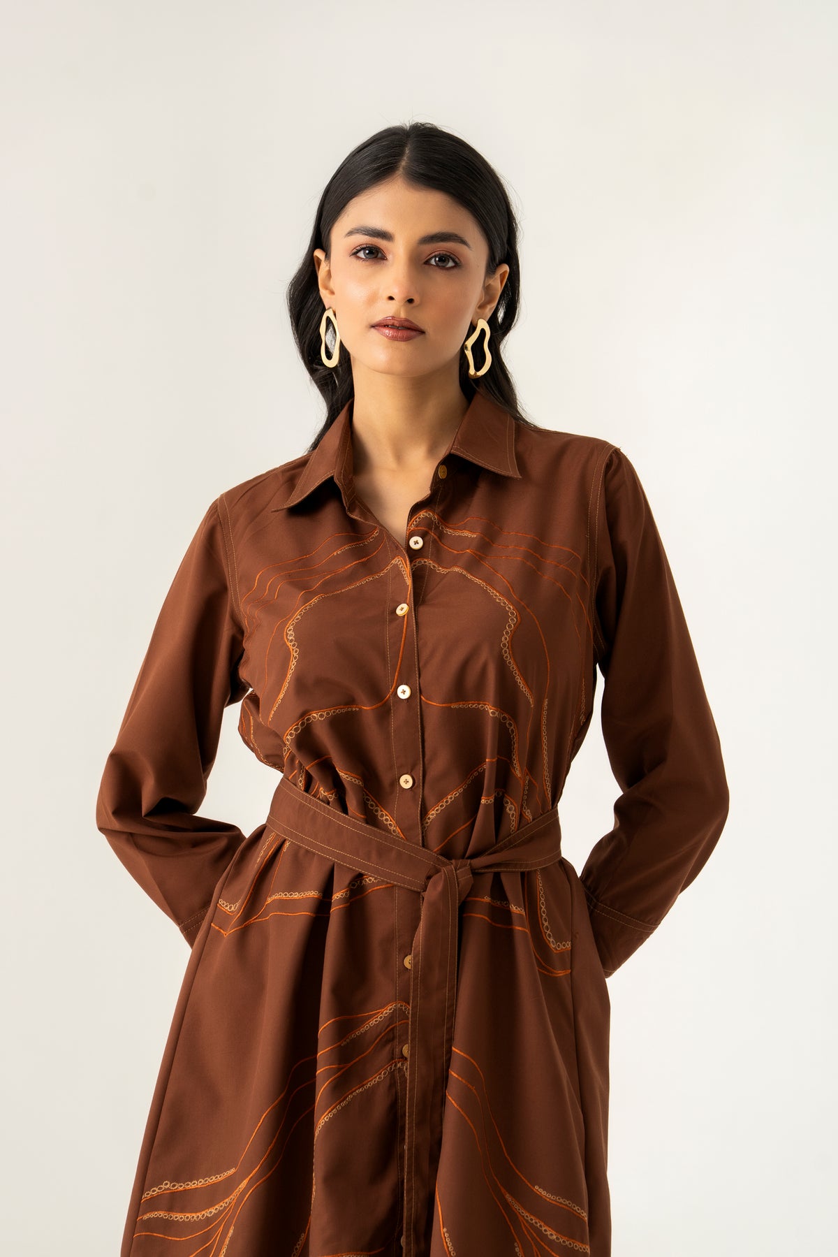 BROWN FLORAL APPLIQUE COTTON SHIRT DRESS WITH TIE UP BELT K.Anshika BROWN FLORAL APPLIQUE COTTON SHIRT DRESS WITH TIE UP BELT K.Anshika